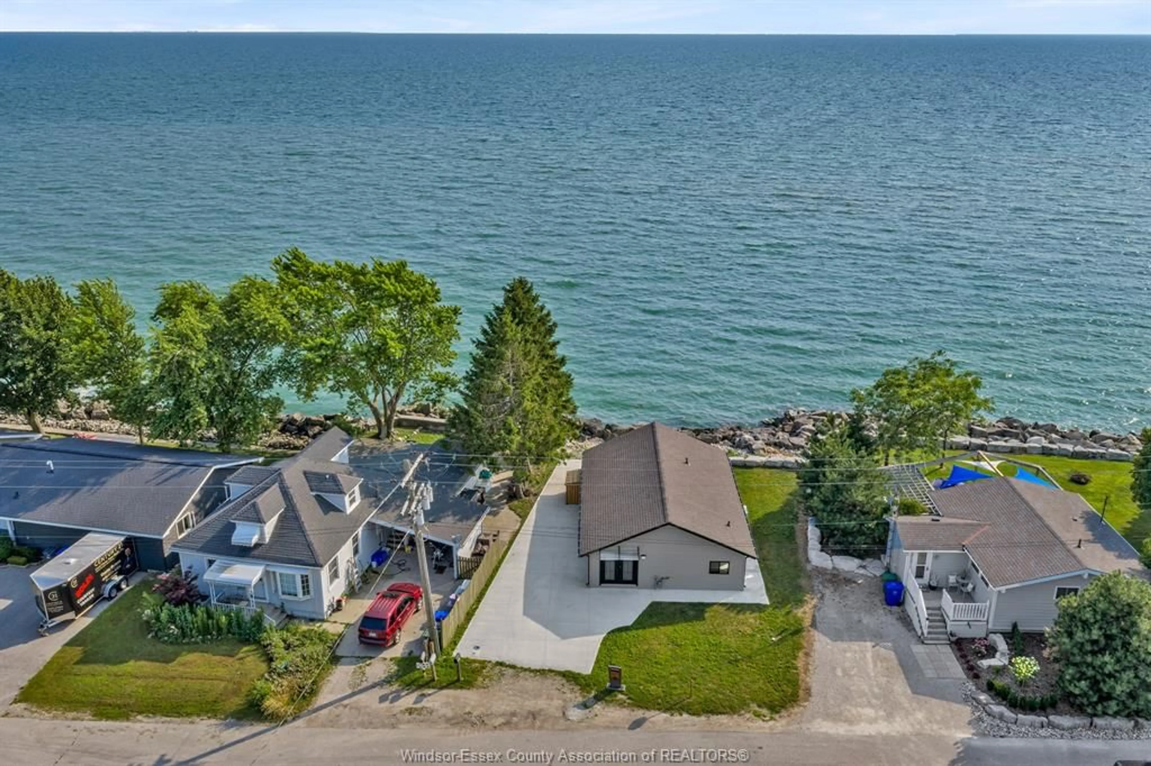 A pic from outside/outdoor area/front of a property/back of a property/a pic from drone, water/lake/river/ocean view for 620 POINT PELEE Dr, Leamington Ontario N8H 3V4