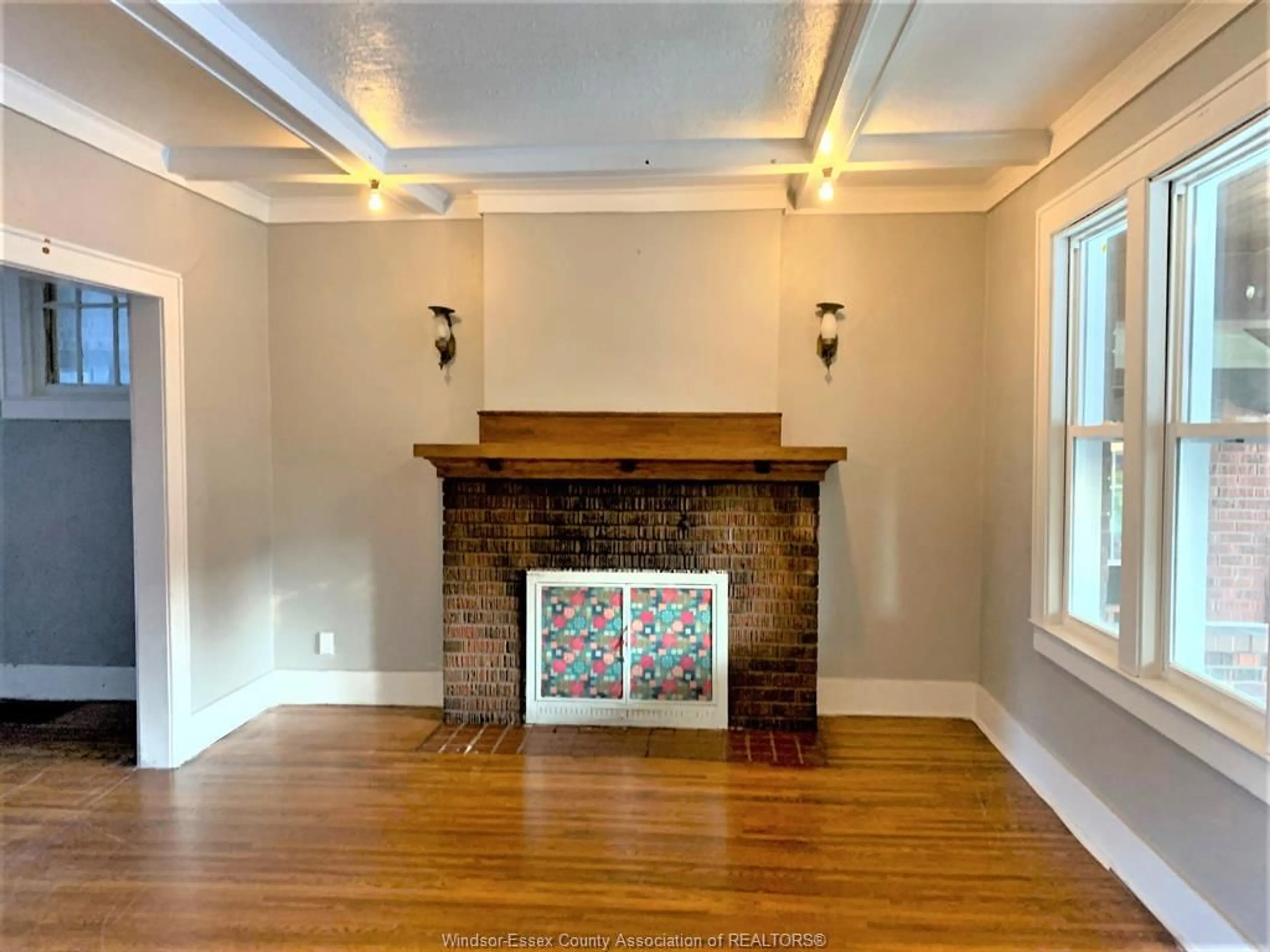 Living room with furniture, wood/laminate floor for 1076 DOUGALL, Windsor Ontario N9A 4R5