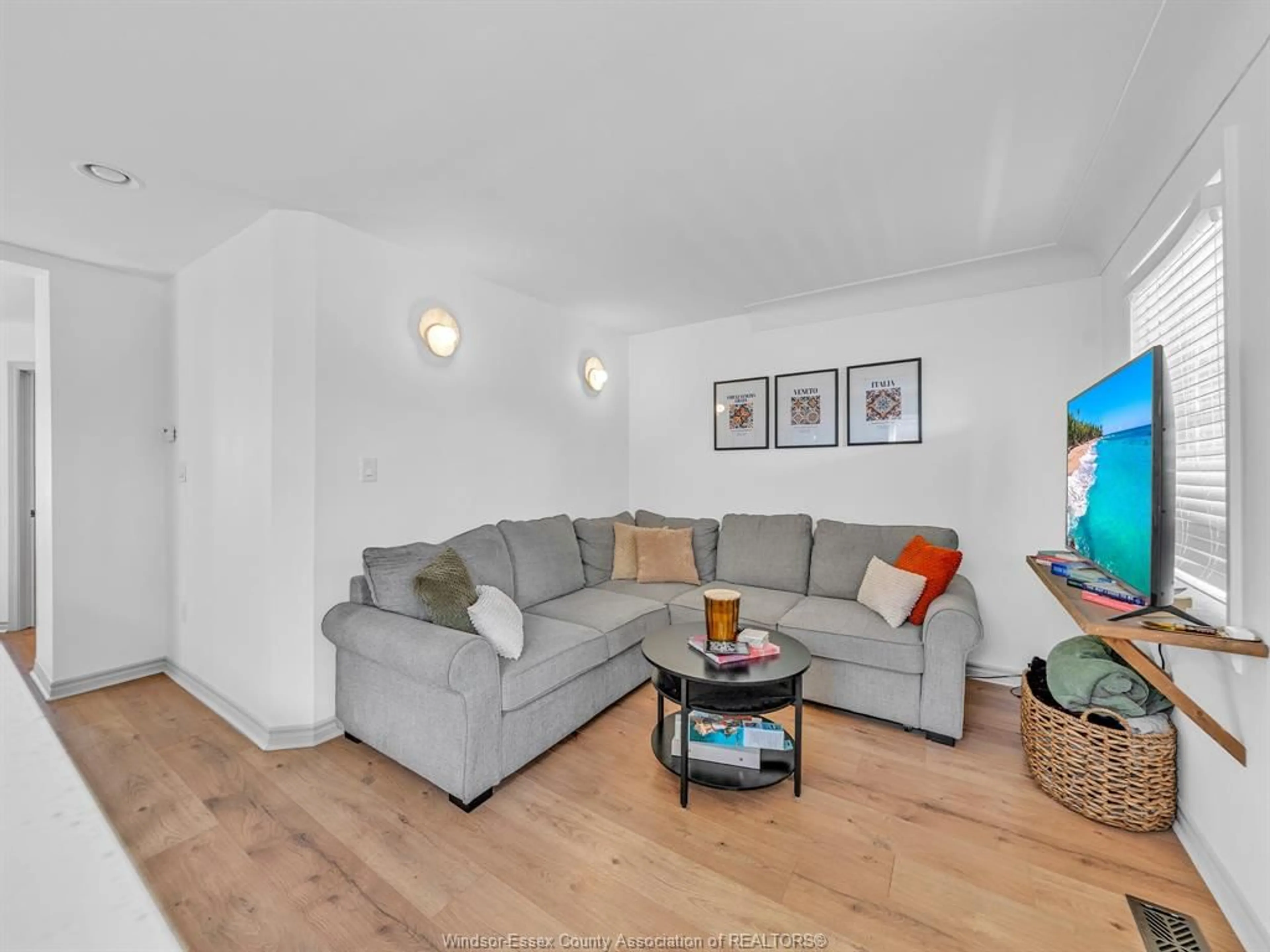 Living room with furniture, wood/laminate floor for 1767 Langlois, Windsor Ontario N8X 4M4