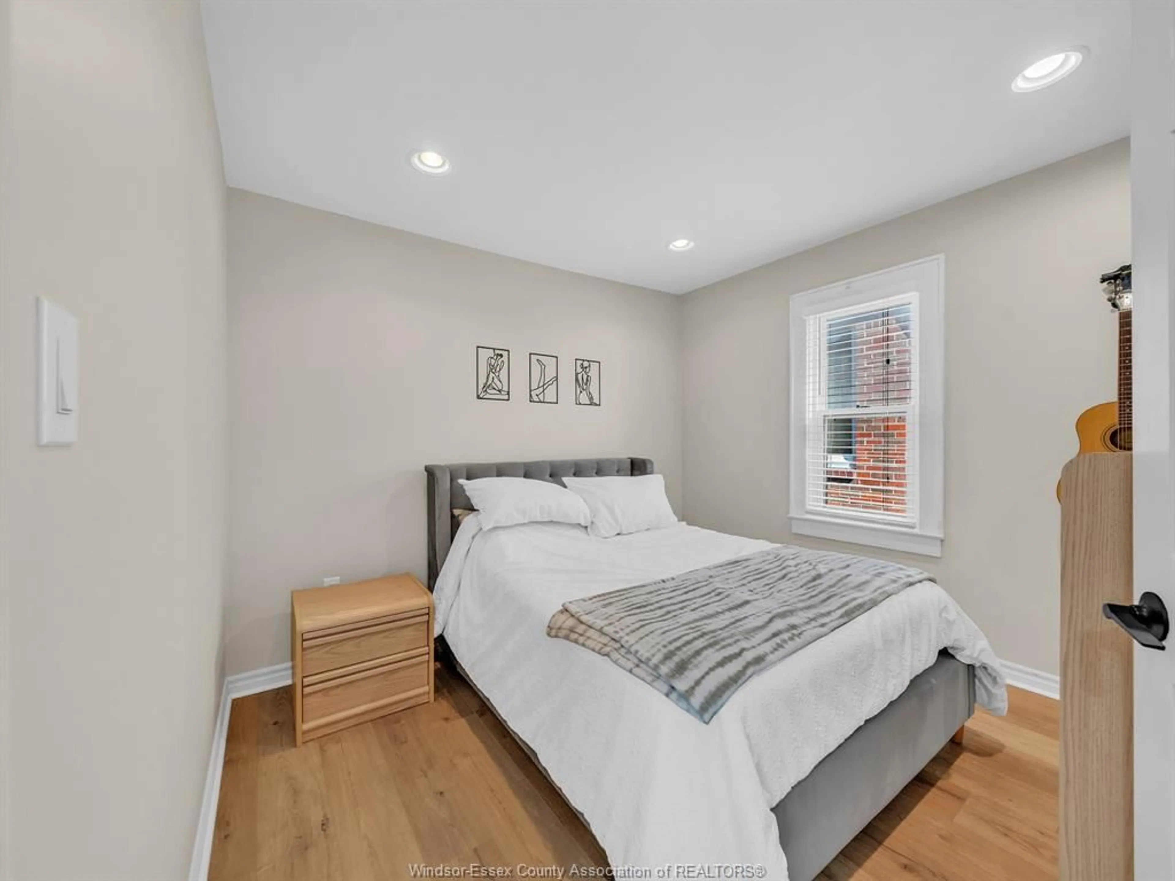 Bedroom with bed, wood/laminate floor for 1767 Langlois, Windsor Ontario N8X 4M4