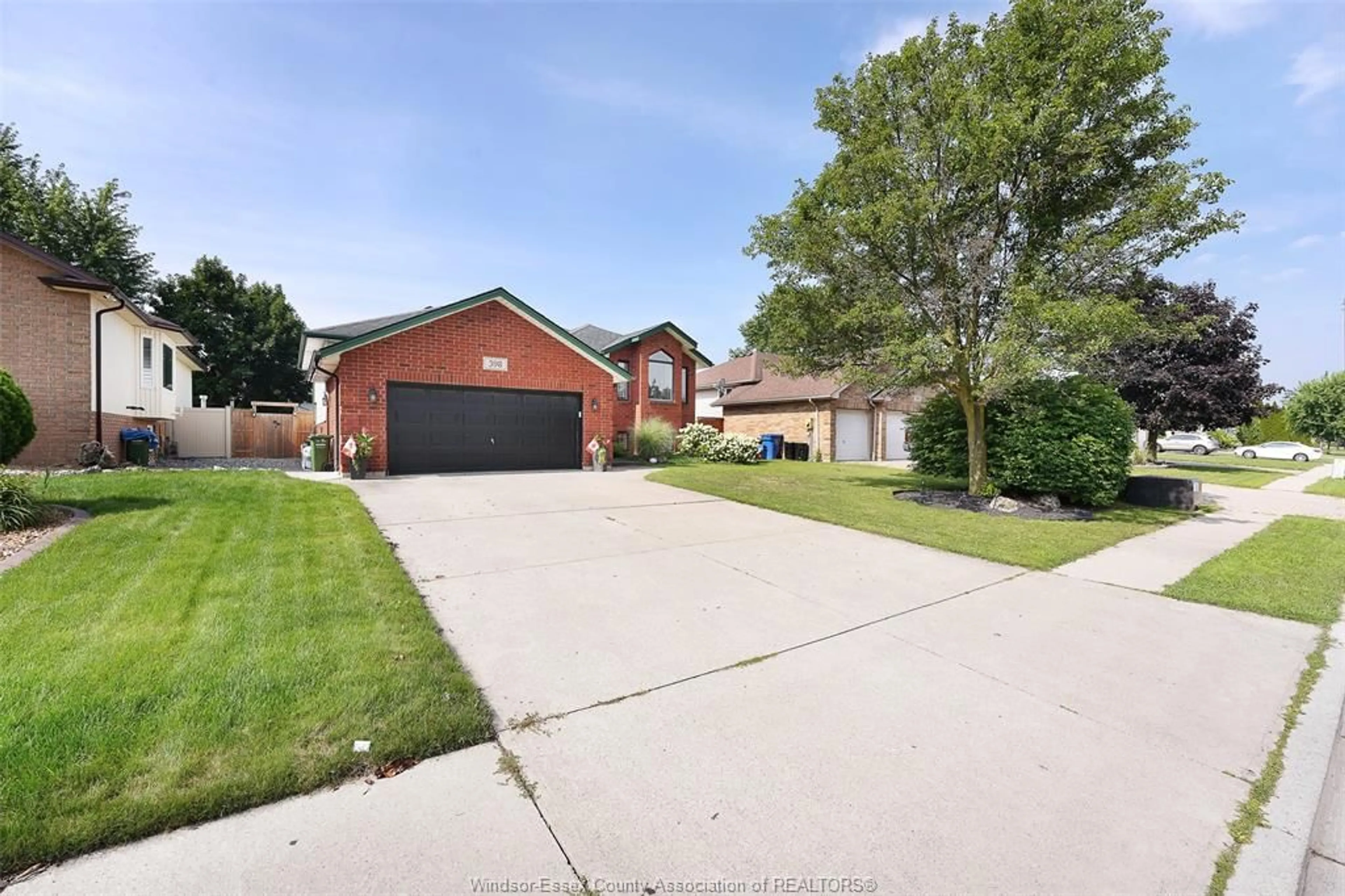 A pic from outside/outdoor area/front of a property/back of a property/a pic from drone, street for 398 International Ave, LaSalle Ontario N9J 3J4
