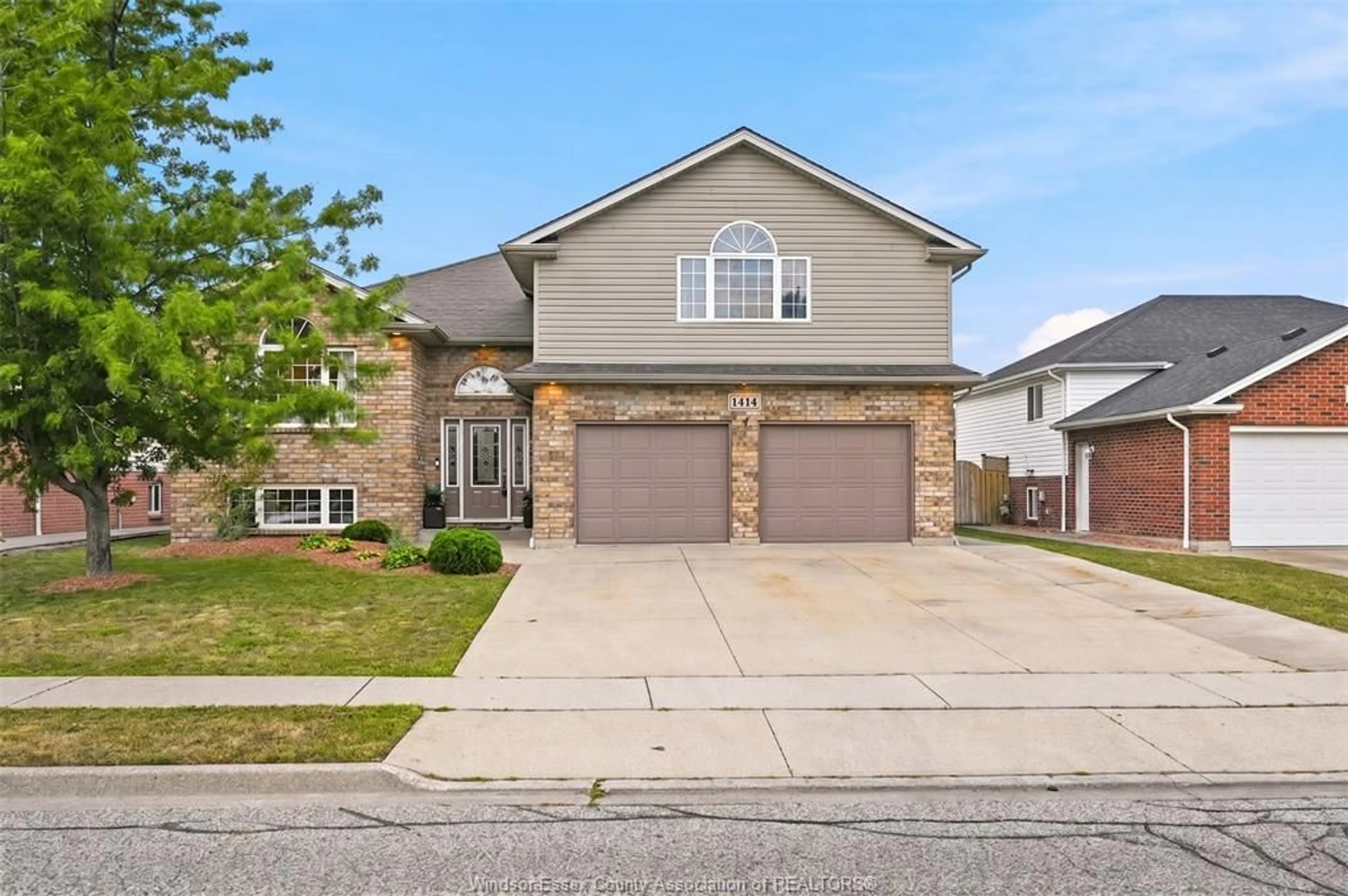 Home with brick exterior material, street for 1414 GIRARD Dr, Lakeshore Ontario N0R 1A0