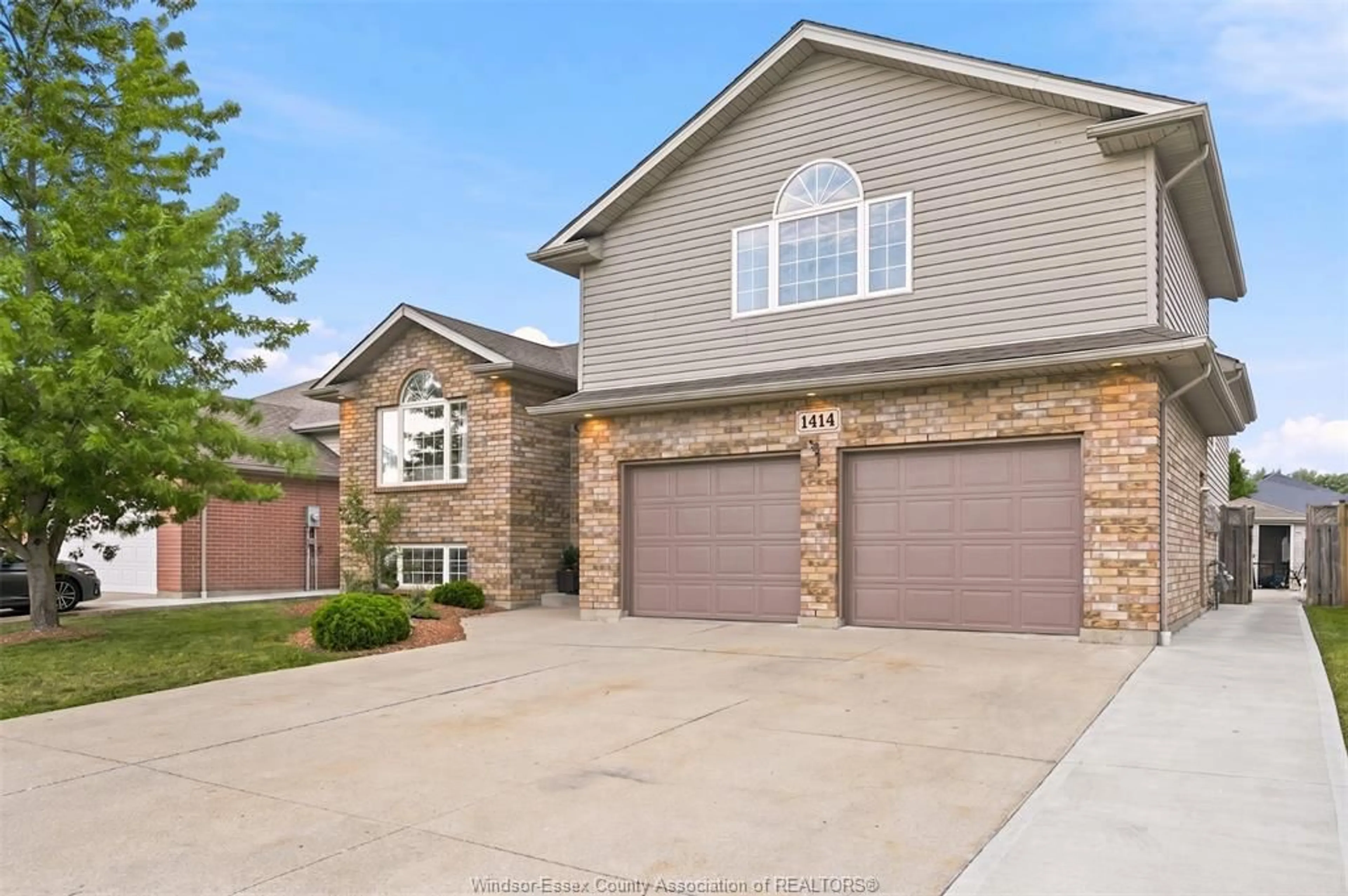 Home with brick exterior material, street for 1414 GIRARD Dr, Lakeshore Ontario N0R 1A0