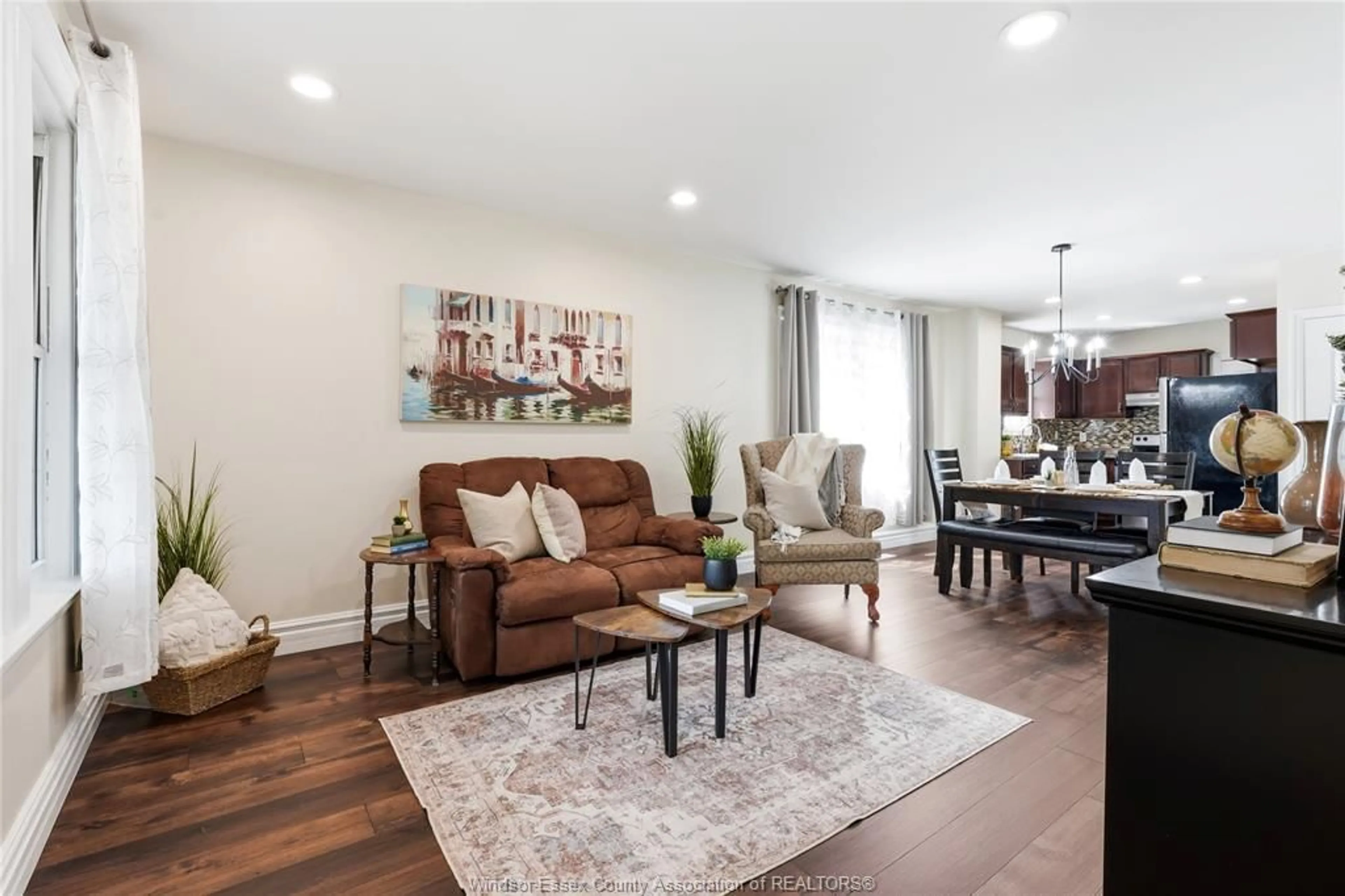 Living room with furniture, wood/laminate floor for 1585 PILLETTE, Windsor Ontario N8Y 3C3