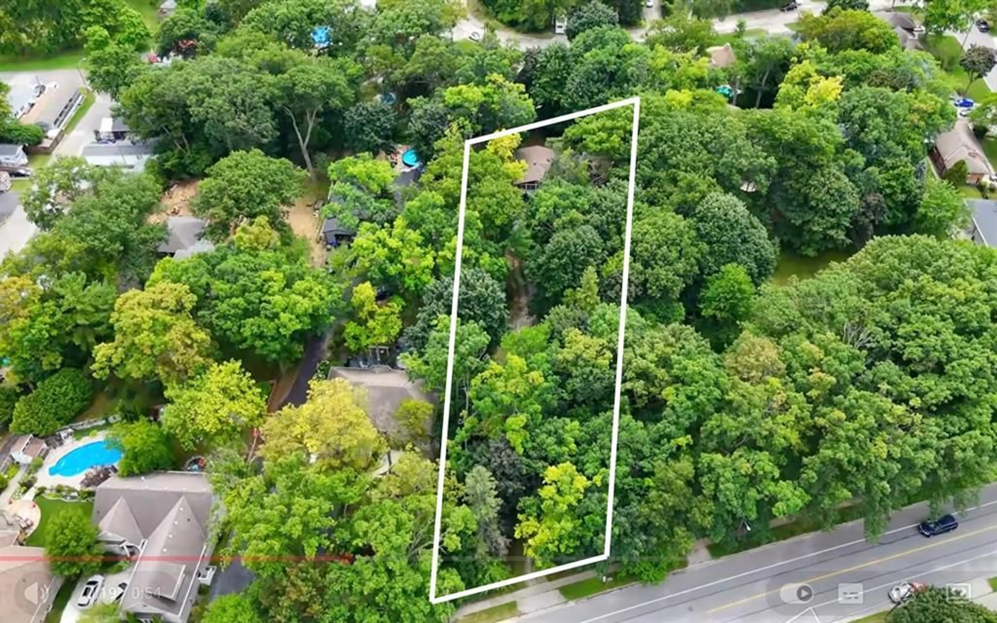 A pic from outside/outdoor area/front of a property/back of a property/a pic from drone, forest/trees view for 1065 Lakeshore Rd, Sarnia Ontario N7V 2V5