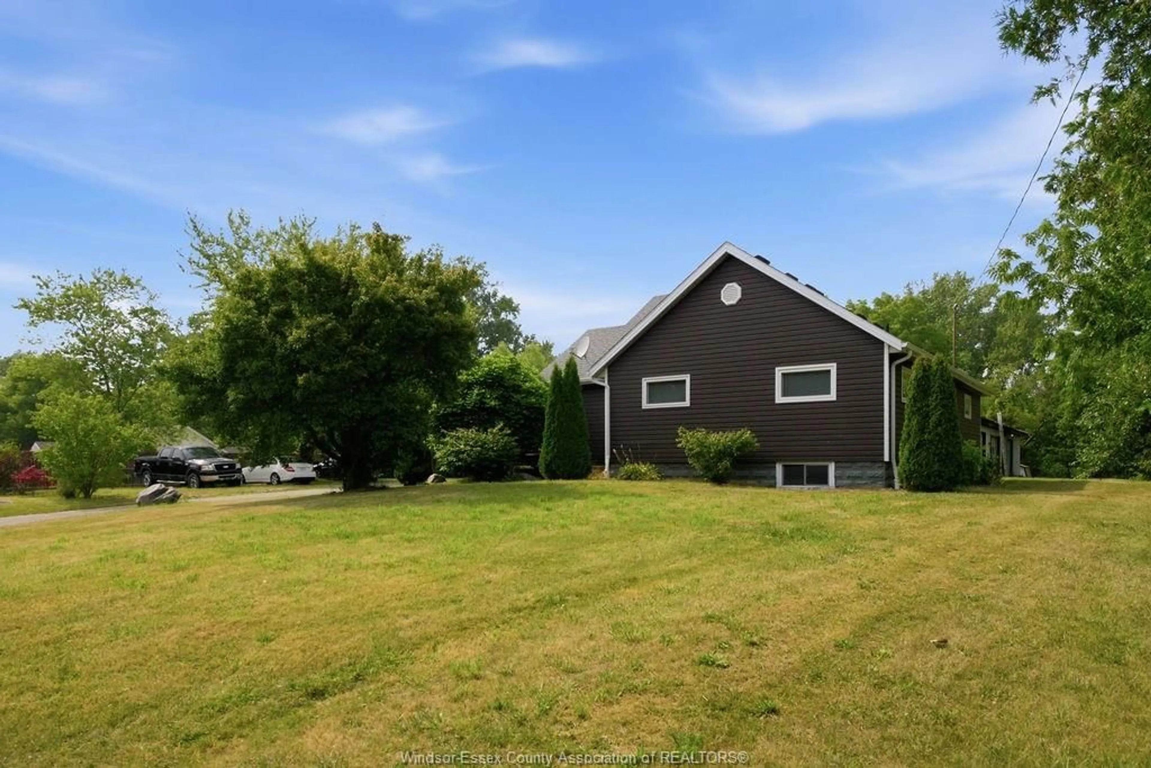 A pic from outside/outdoor area/front of a property/back of a property/a pic from drone, unknown for 617 TALBOT TRAIL, Wheatley Ontario N0P 2P0
