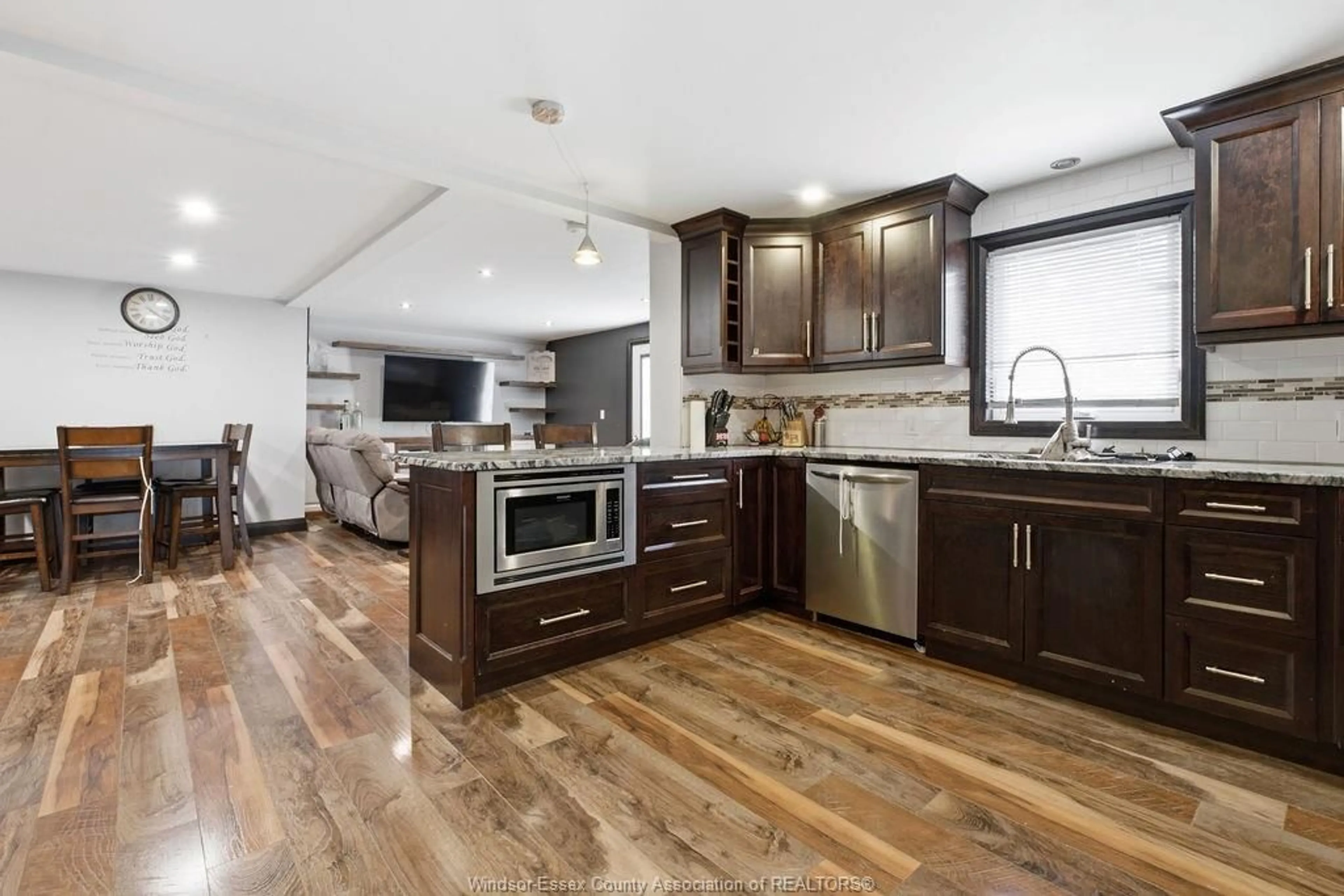 Open concept kitchen, wood/laminate floor for 617 TALBOT TRAIL, Wheatley Ontario N0P 2P0