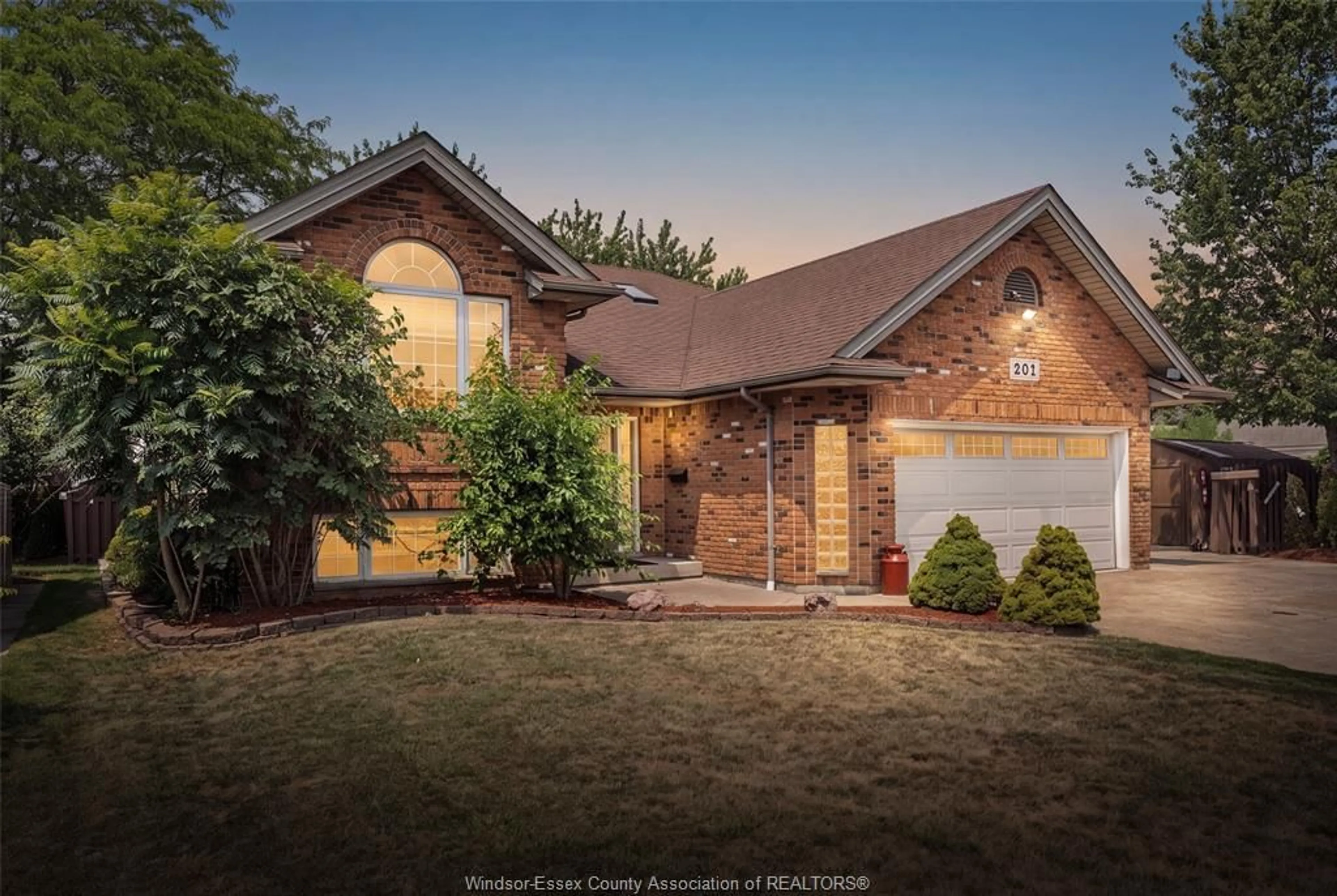 Home with brick exterior material, street for 201 MAPLEWOOD Dr, Lakeshore Ontario N8L 1C2
