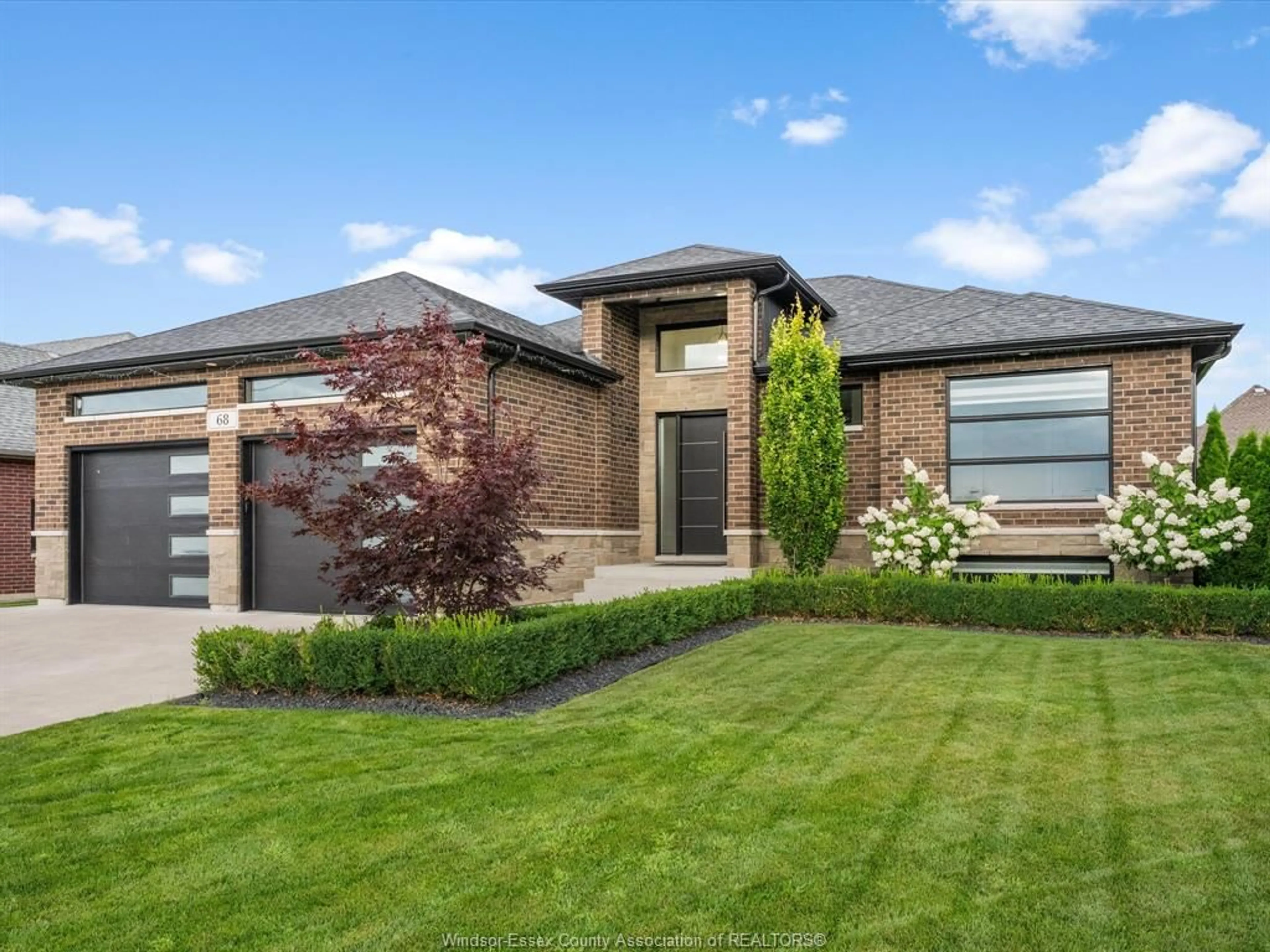 Home with brick exterior material, street for 68 CONSERVATION Blvd, Kingsville Ontario N9Y 0A7