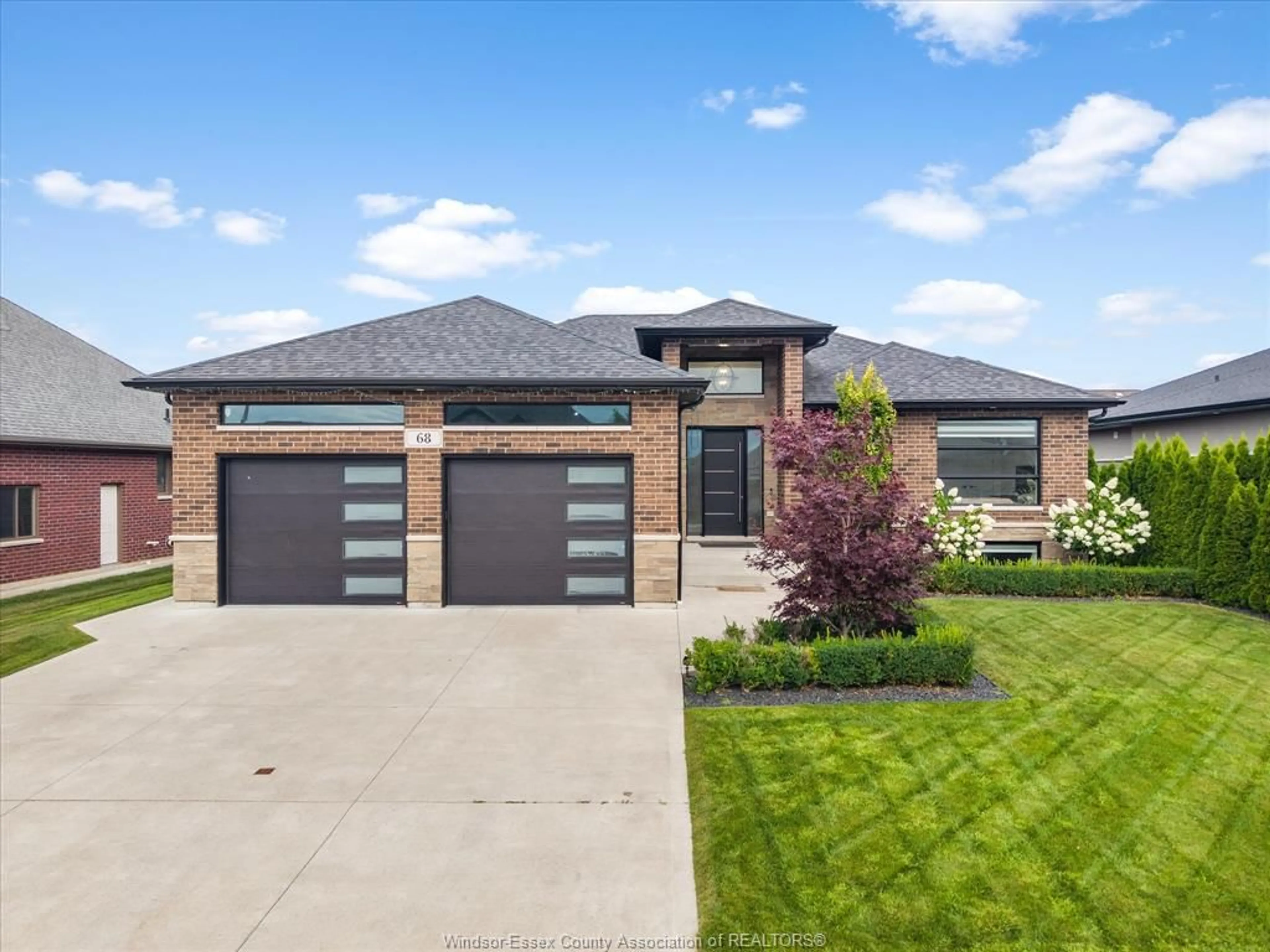 Home with brick exterior material, street for 68 CONSERVATION Blvd, Kingsville Ontario N9Y 0A7
