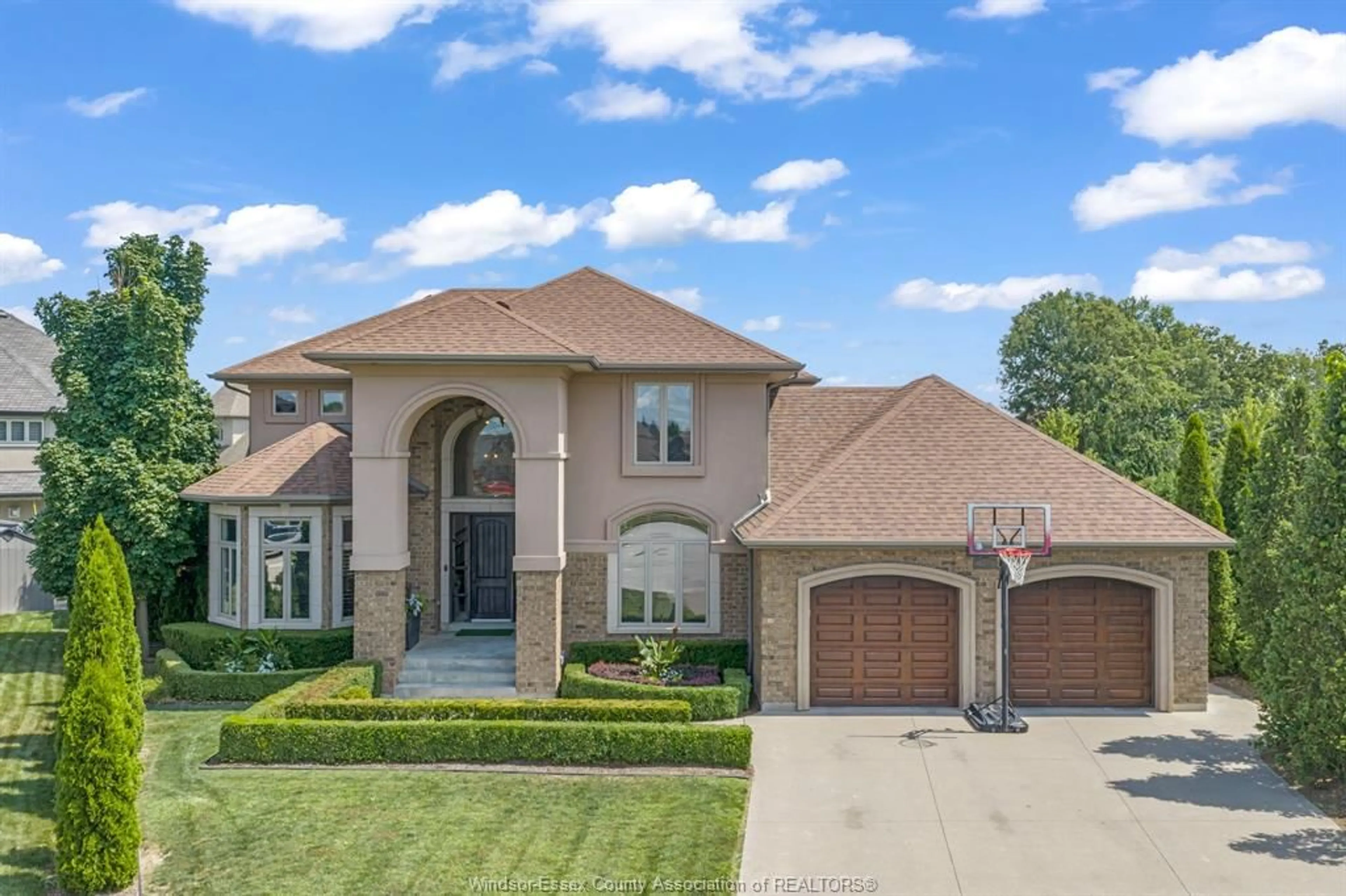 Home with brick exterior material, street for 1060 WOODLAND Cres, Lakeshore Ontario N0R 1A0