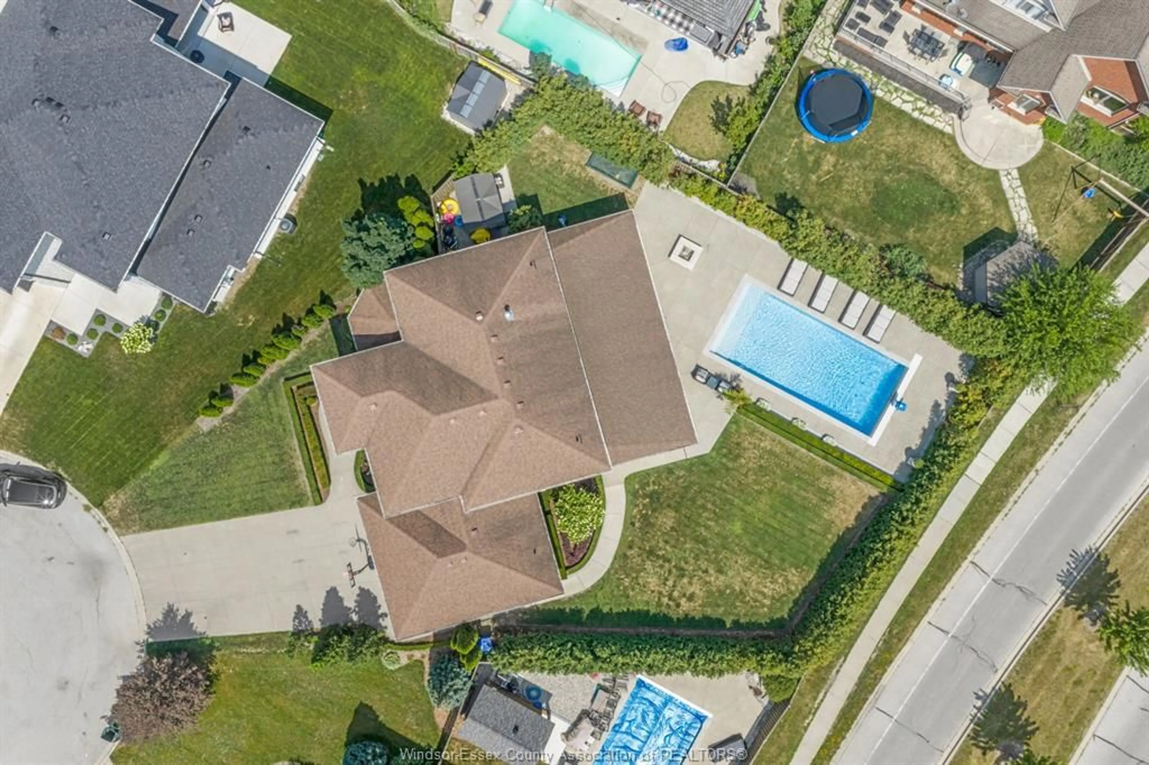 A pic from outside/outdoor area/front of a property/back of a property/a pic from drone, street for 1060 WOODLAND Cres, Lakeshore Ontario N0R 1A0