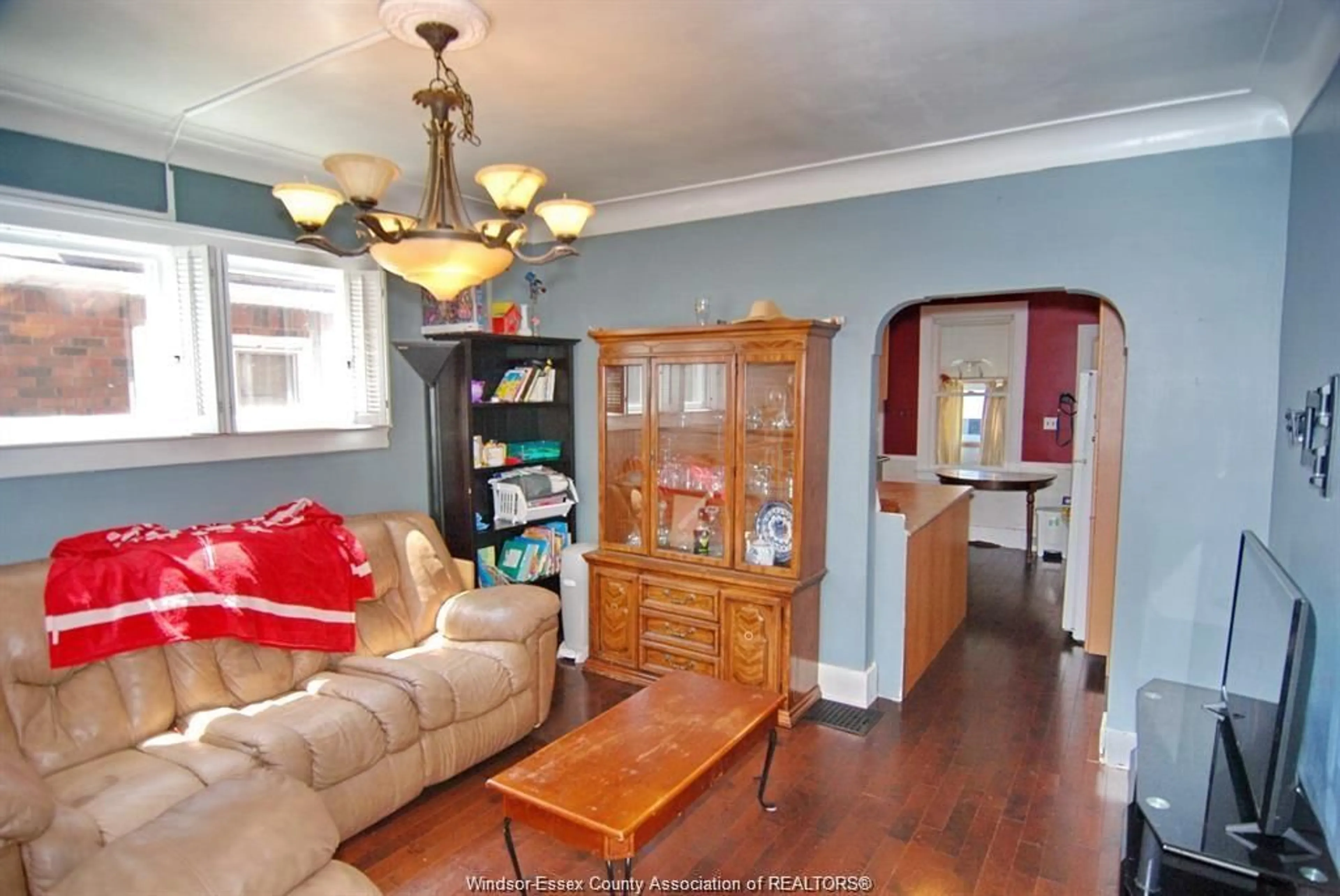 Living room with furniture, wood/laminate floor for 1409 HENRY FORD CENTRE, Windsor Ontario N8Y 2V2