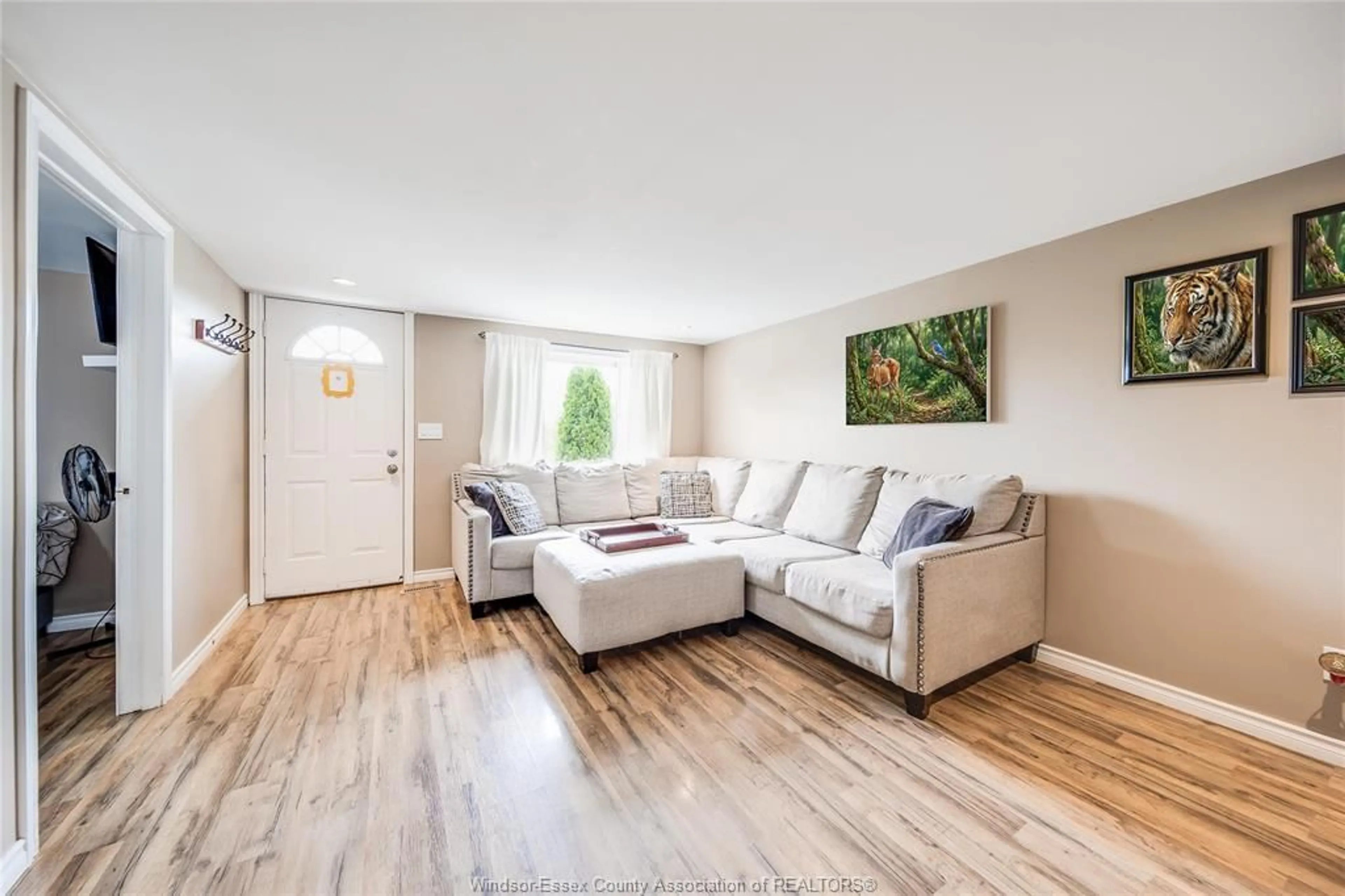 Living room with furniture, wood/laminate floor for 518 ARQUETTE Ave, McGregor Ontario N0R 1J0