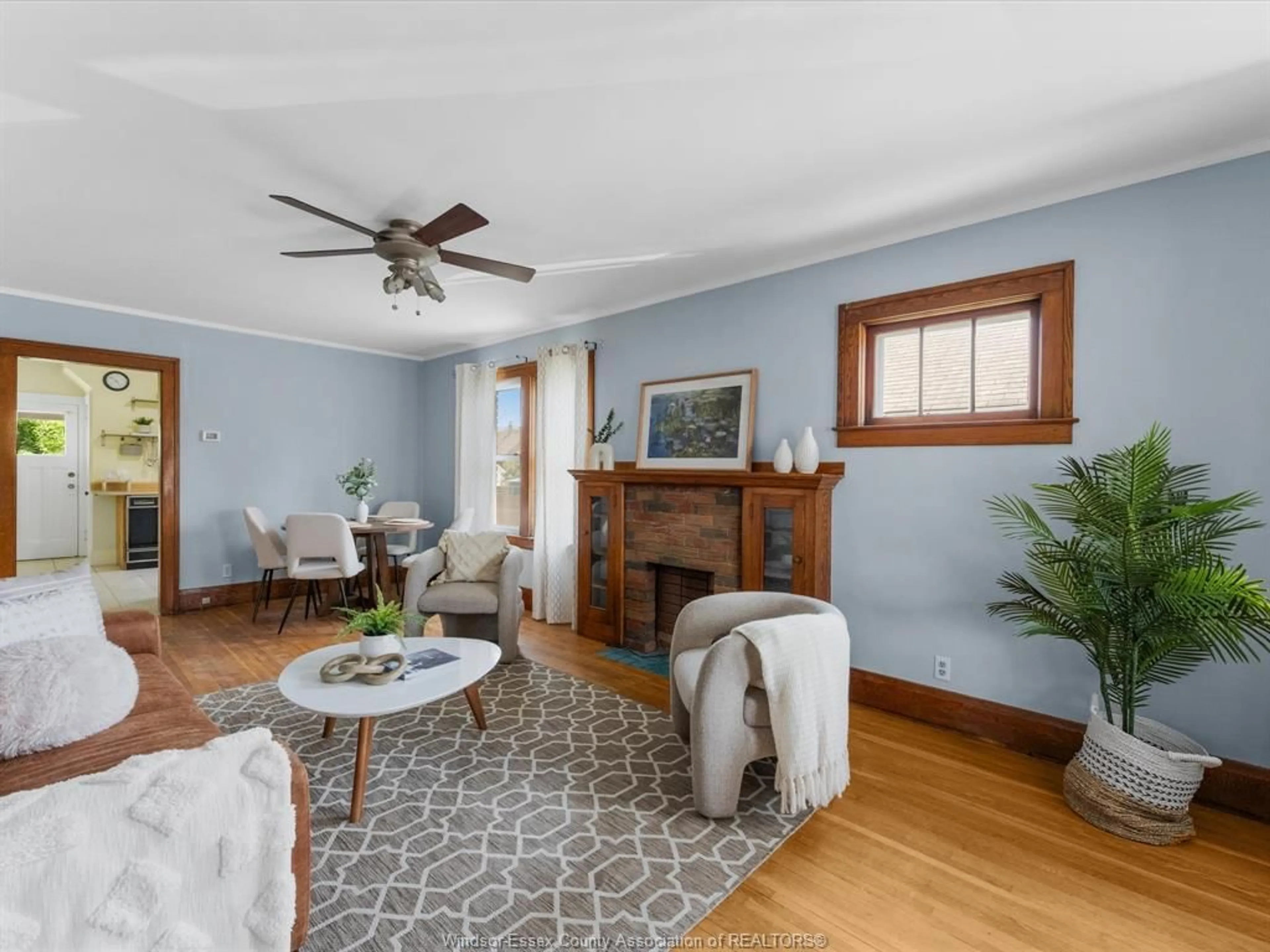 Living room with furniture, wood/laminate floor for 1794 HALL Ave, Windsor Ontario N8W 2L4