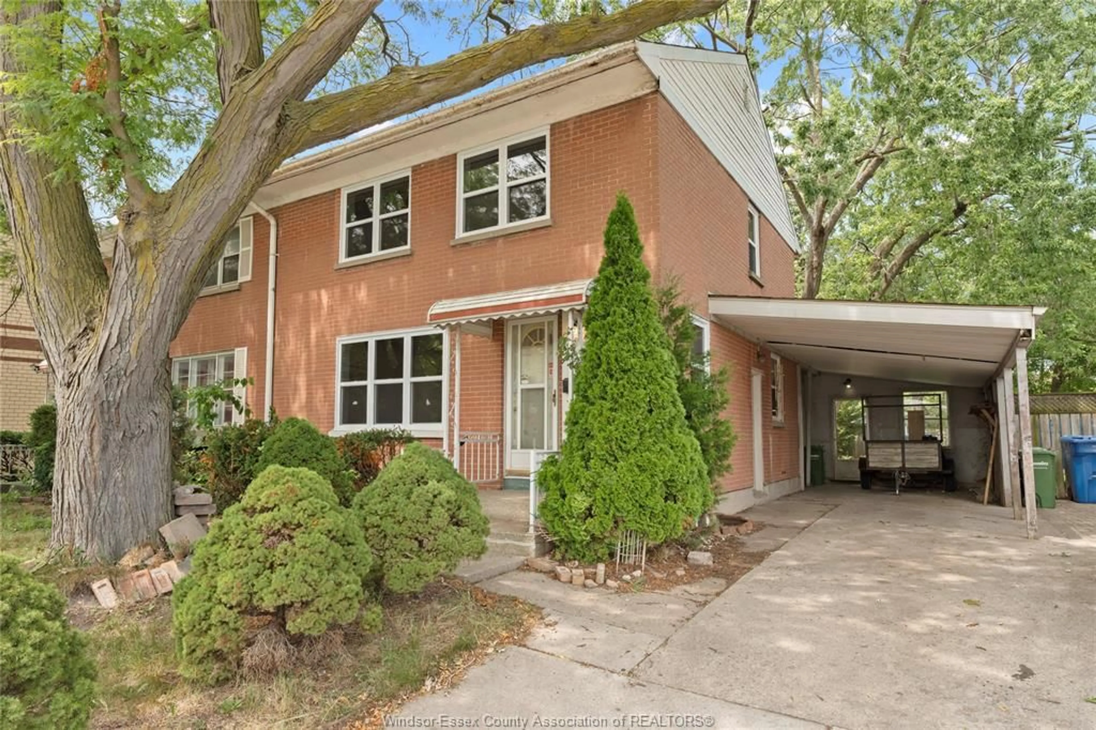 Home with brick exterior material, street for 2330 TECUMSEH Rd, Windsor Ontario N9B 1W1