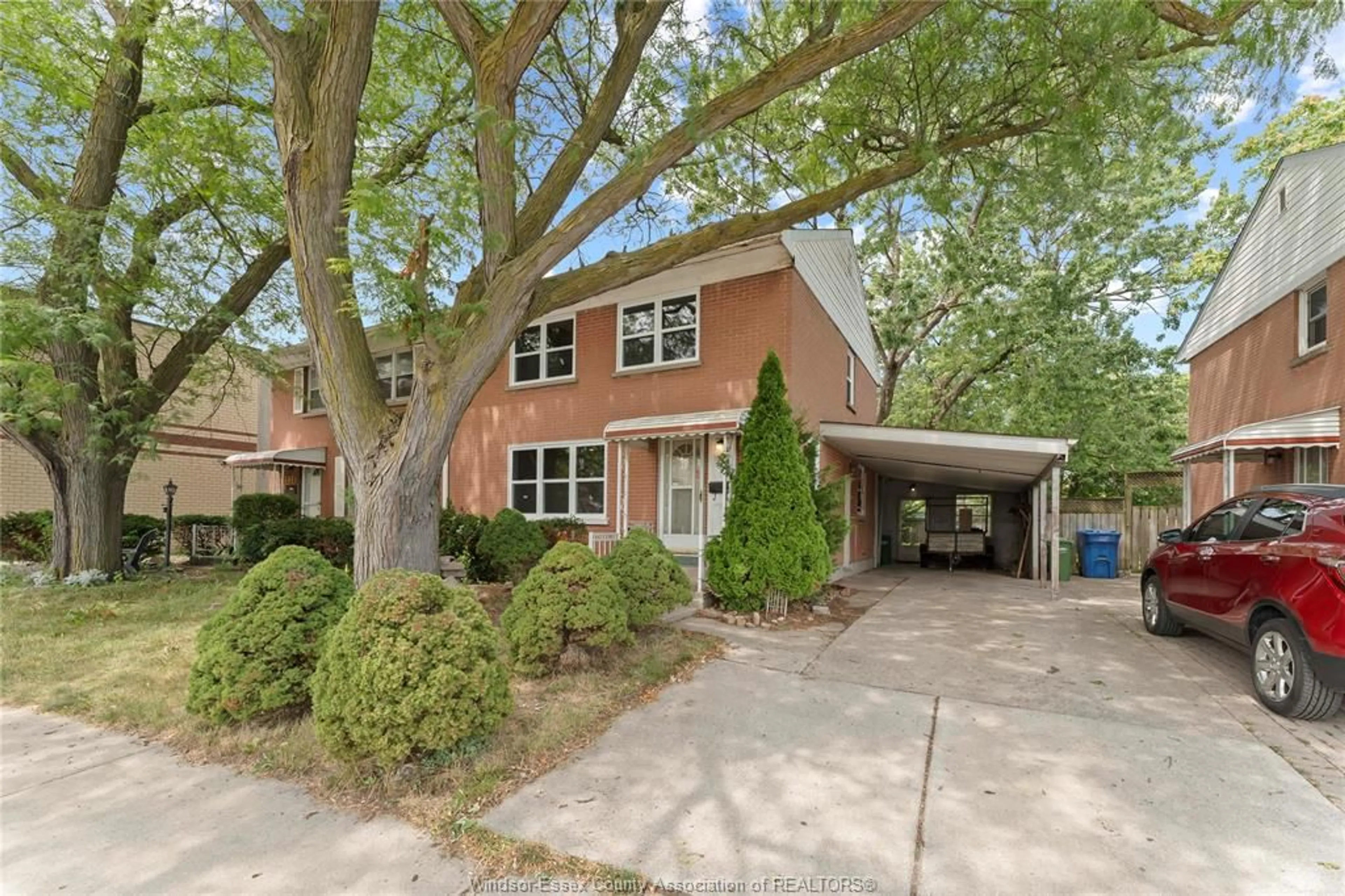 Home with brick exterior material, street for 2330 TECUMSEH Rd, Windsor Ontario N9B 1W1