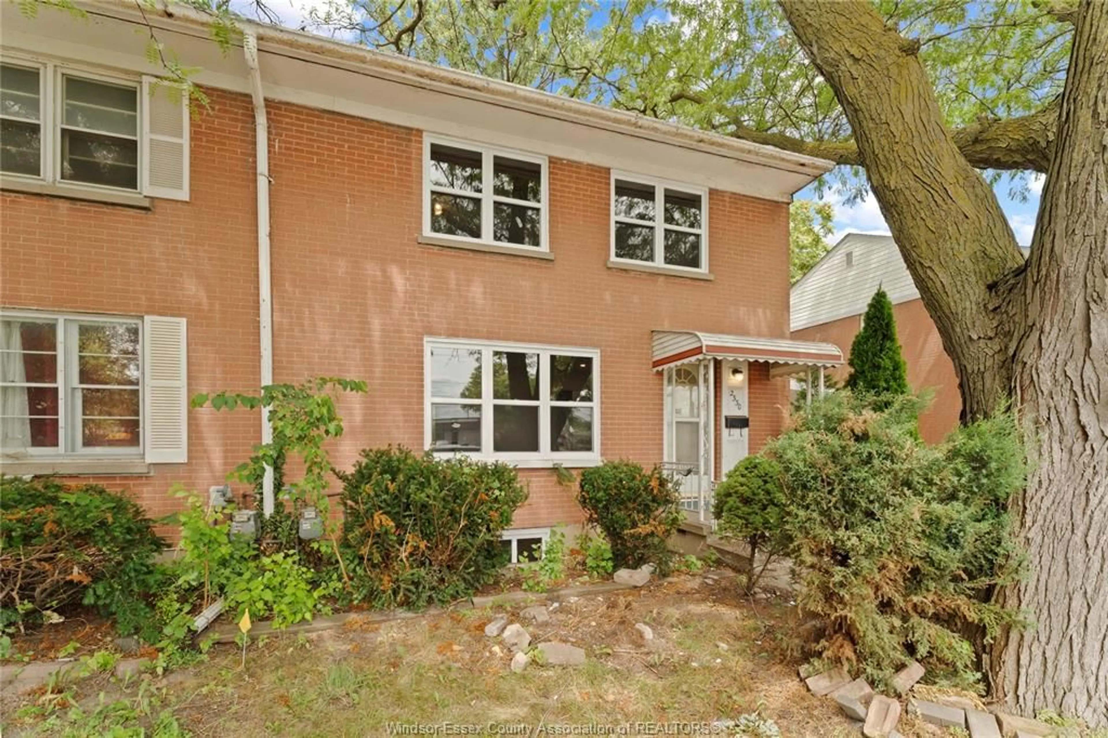 Home with brick exterior material, street for 2330 TECUMSEH Rd, Windsor Ontario N9B 1W1
