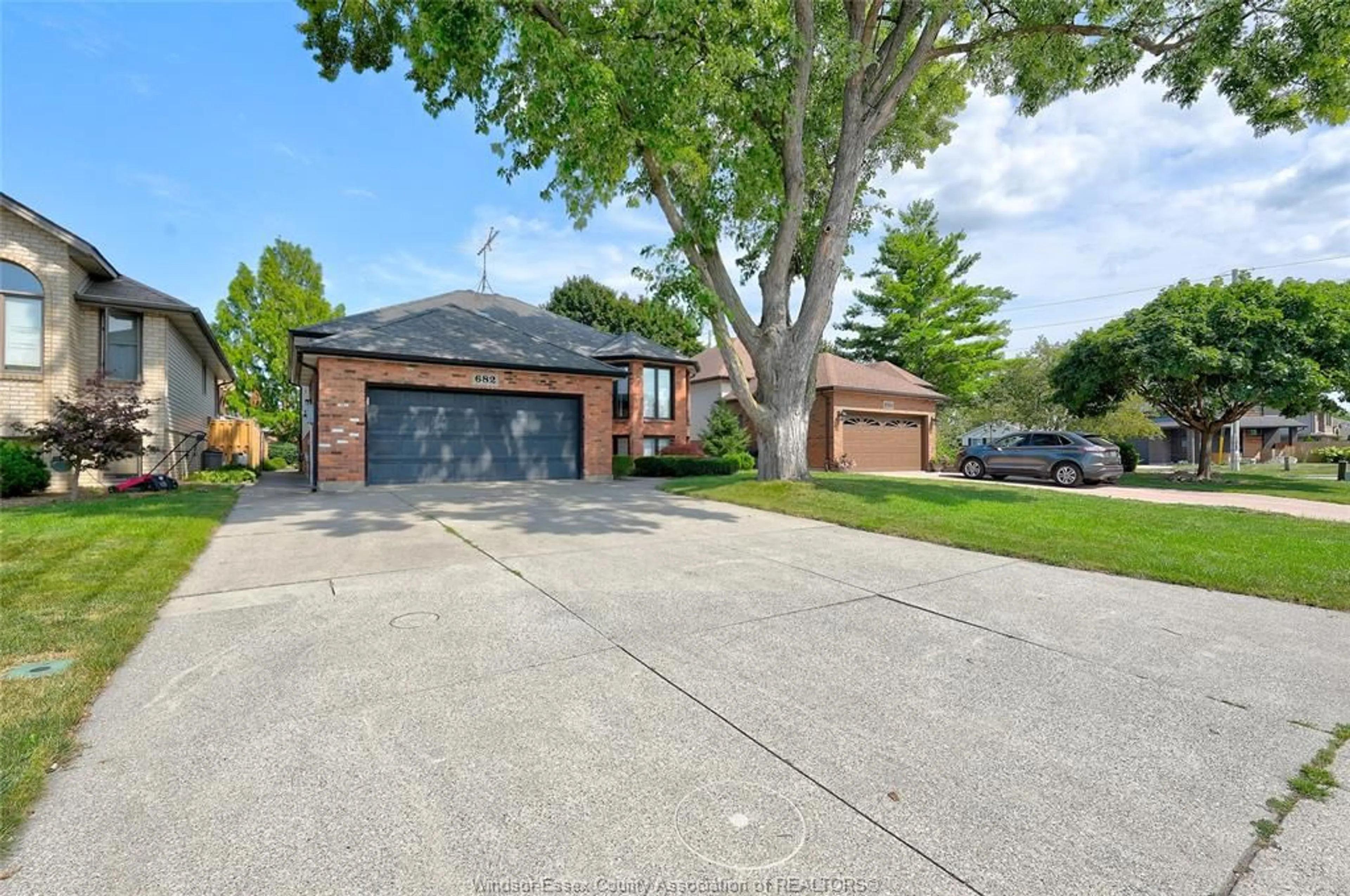 A pic from outside/outdoor area/front of a property/back of a property/a pic from drone, street for 682 MICHAEL Dr, Tecumseh Ontario N8N 4N2