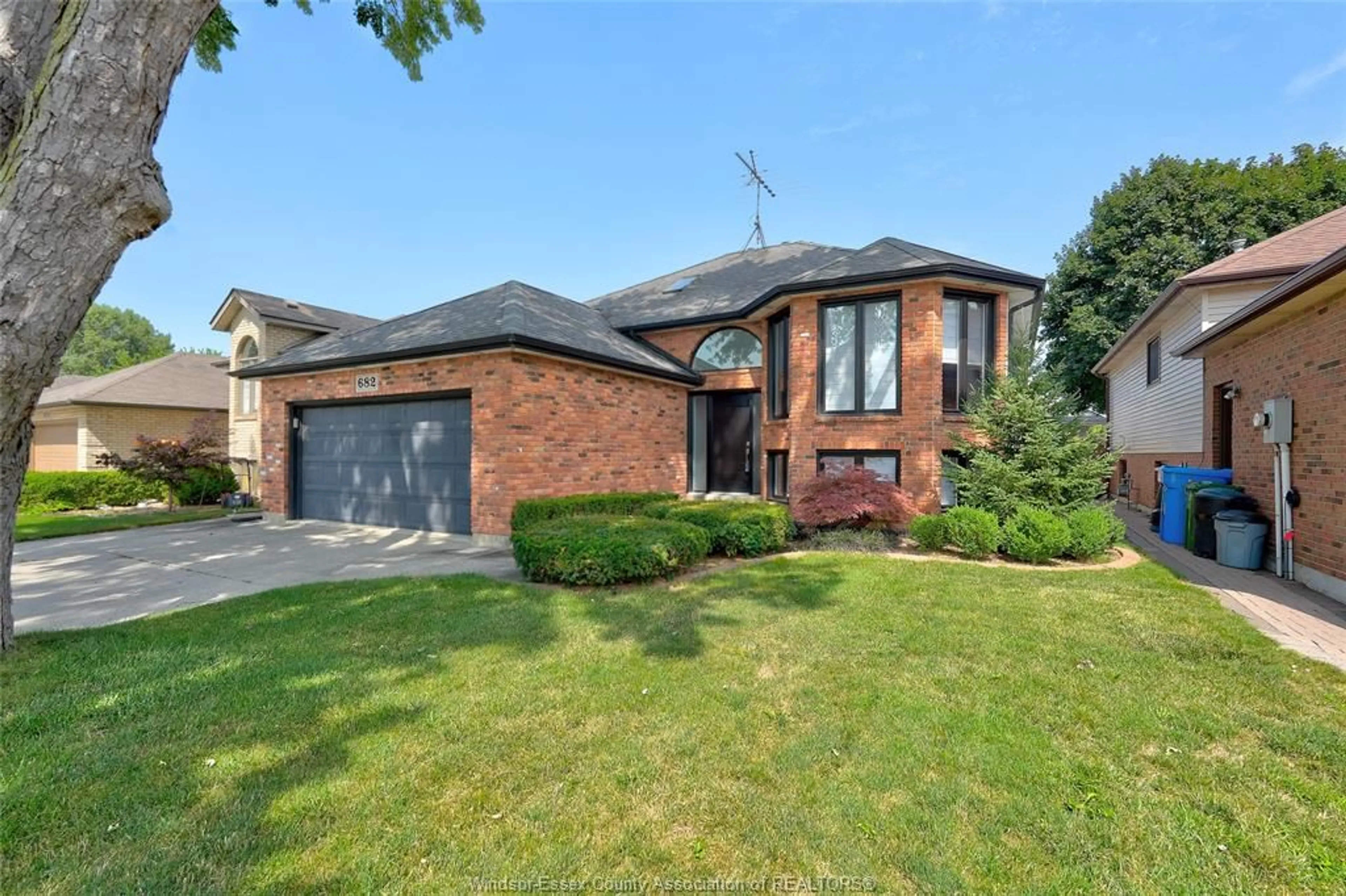 Home with brick exterior material, street for 682 MICHAEL Dr, Tecumseh Ontario N8N 4N2