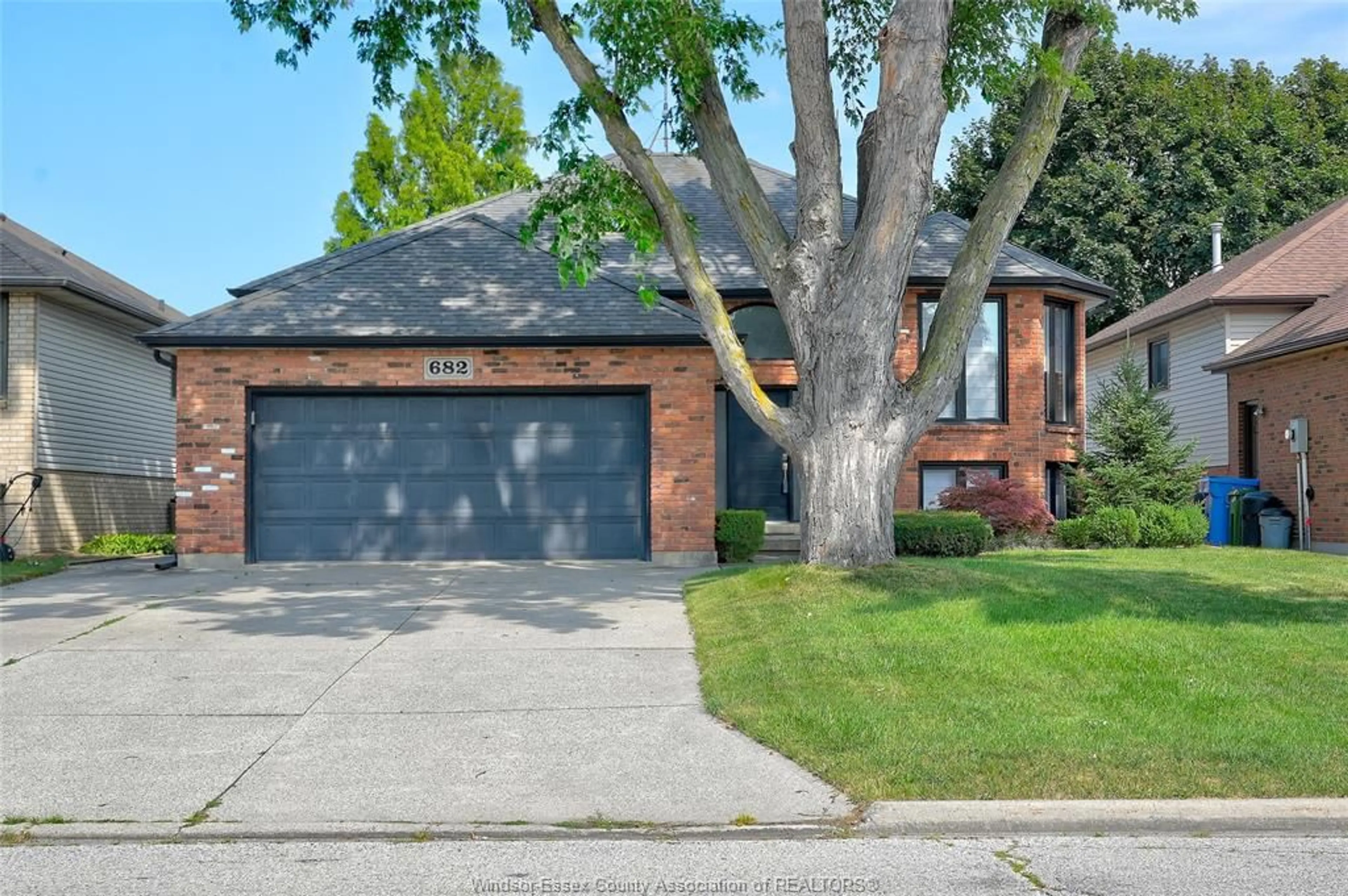 Home with brick exterior material, street for 682 MICHAEL Dr, Tecumseh Ontario N8N 4N2
