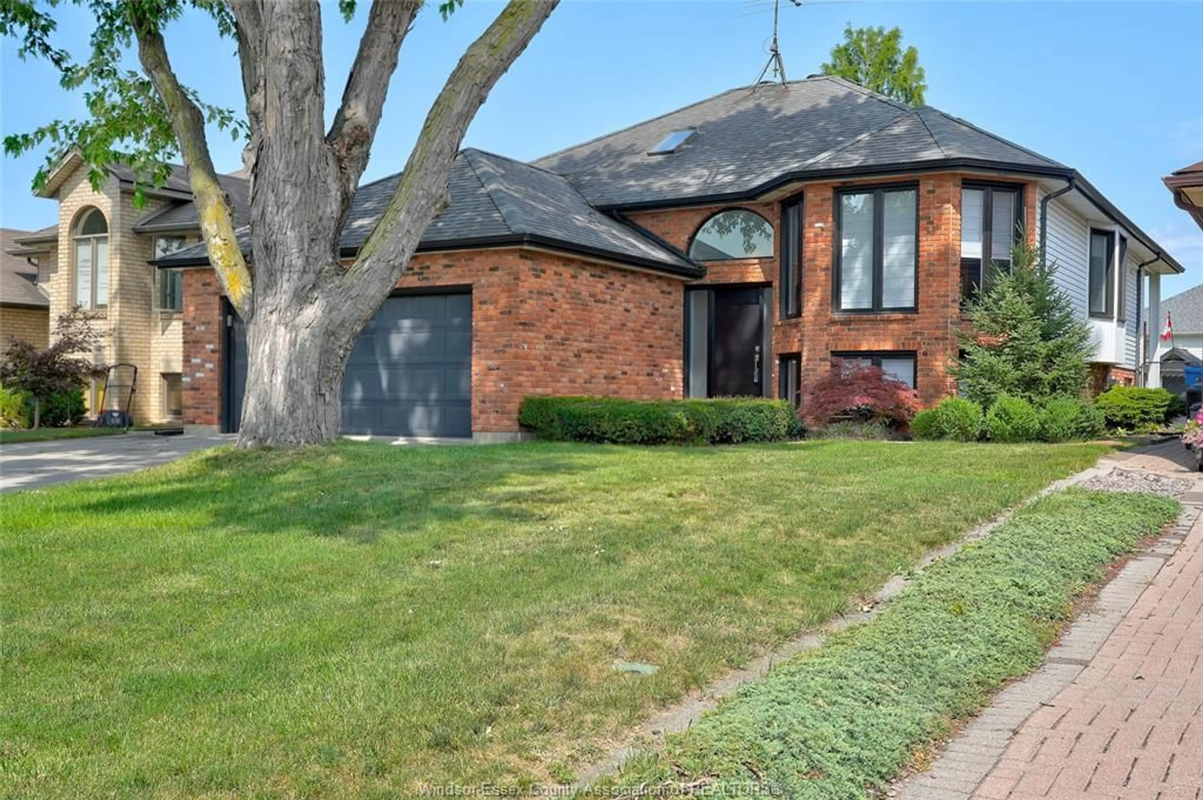Home with brick exterior material, street for 682 MICHAEL Dr, Tecumseh Ontario N8N 4N2