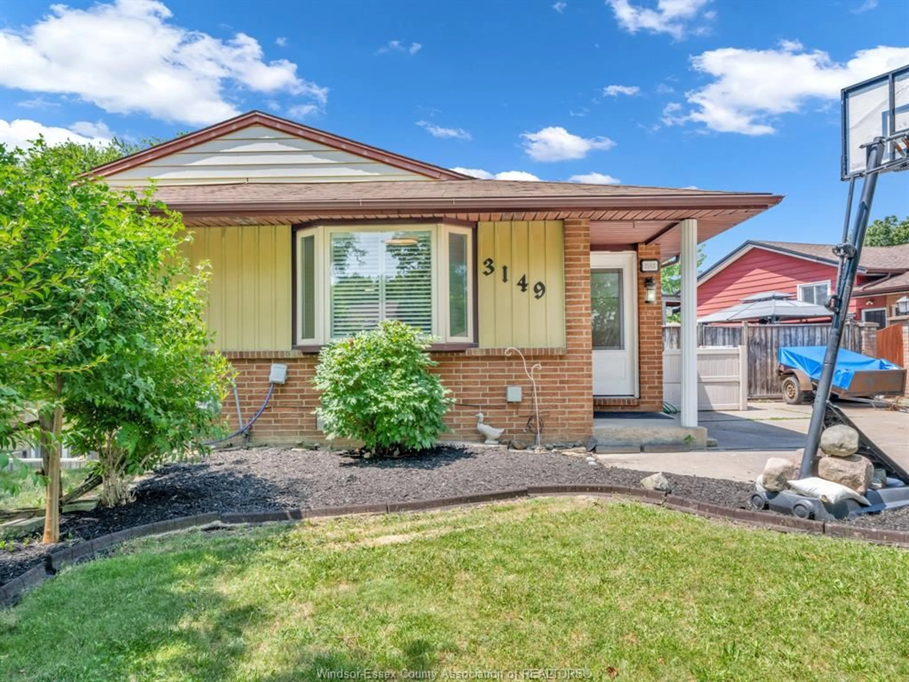 Home with brick exterior material, street for 3149 ELMWOOD Cres, Windsor Ontario N8R 1X5