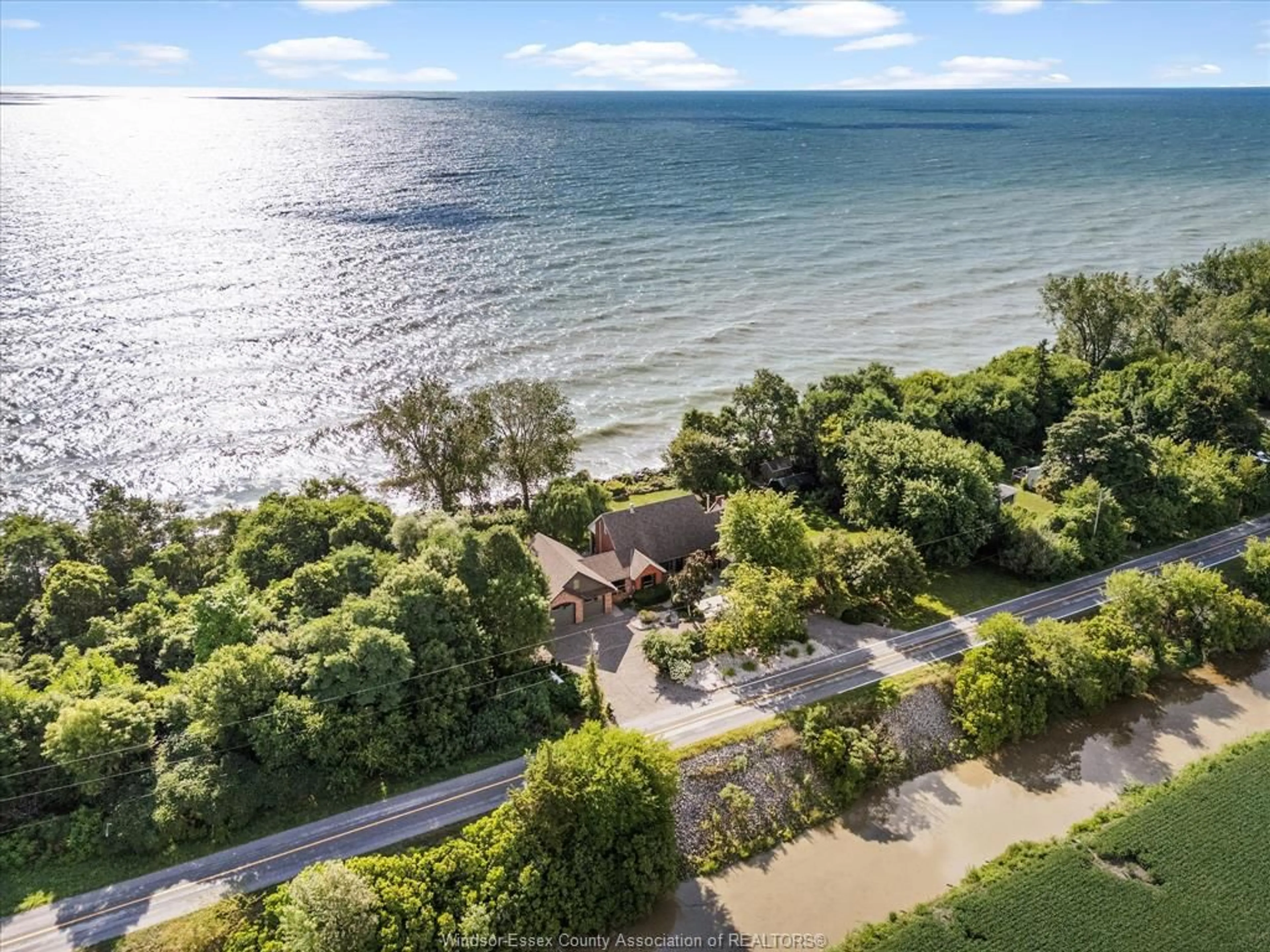 A pic from outside/outdoor area/front of a property/back of a property/a pic from drone, water/lake/river/ocean view for 266 EAST BEACH Rd, Leamington Ontario N8H 3V7