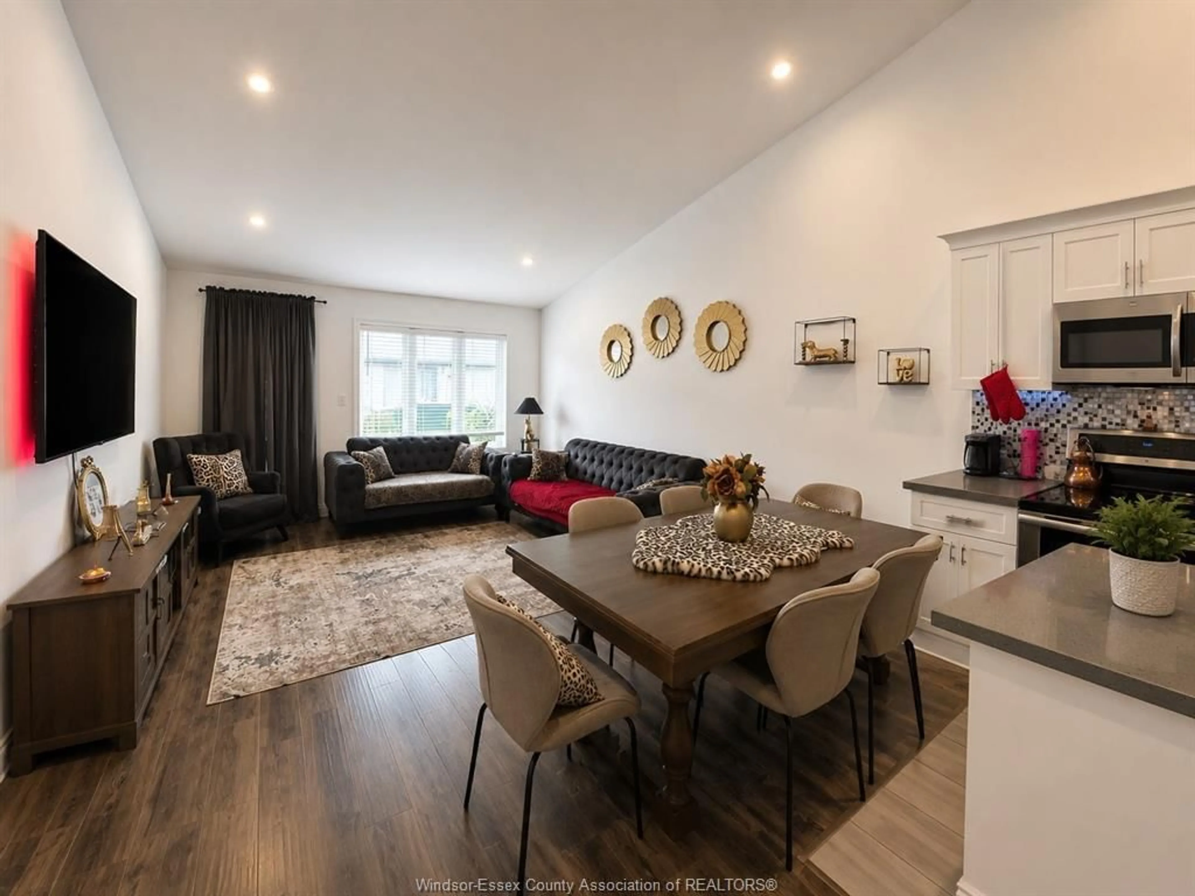 Living room with furniture, wood/laminate floor for 3639 HALLEE Cres, Windsor Ontario N8W 0B2