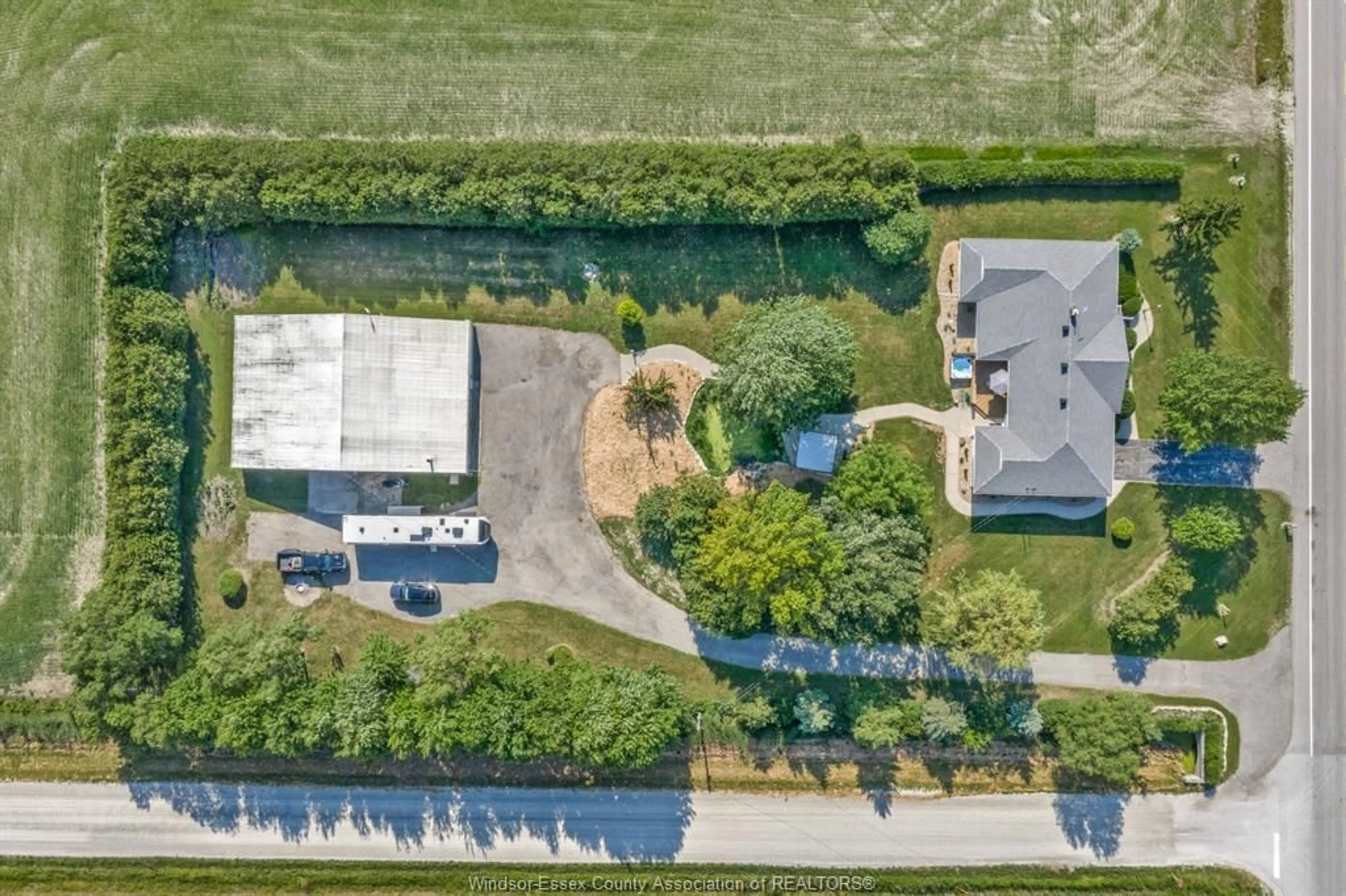 A pic from outside/outdoor area/front of a property/back of a property/a pic from drone, street for 7695 County Rd 18, Essex Ontario N0R 1B0