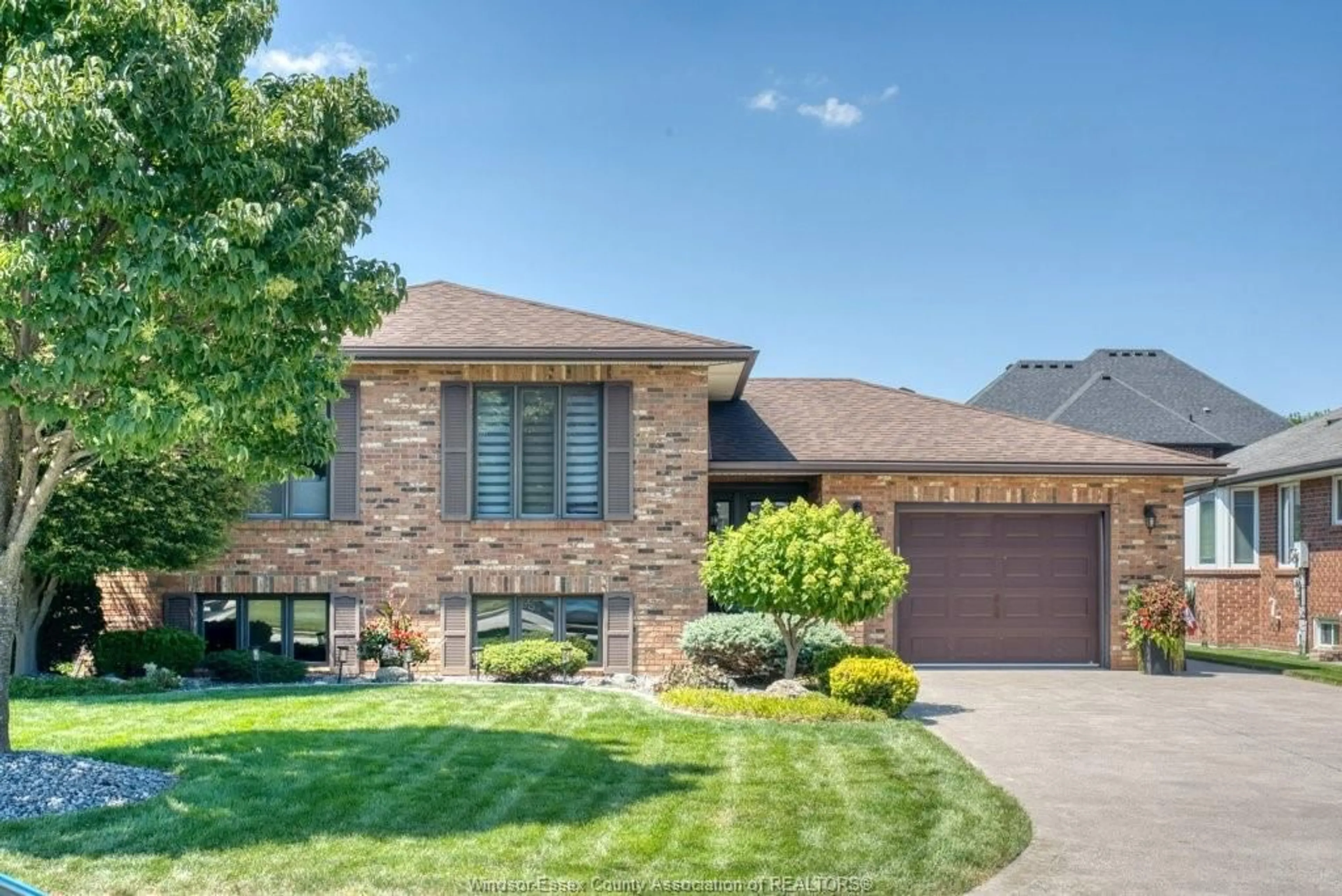 Home with brick exterior material, street for 1030 Dandurand Crt, Windsor Ontario N9E 4K5