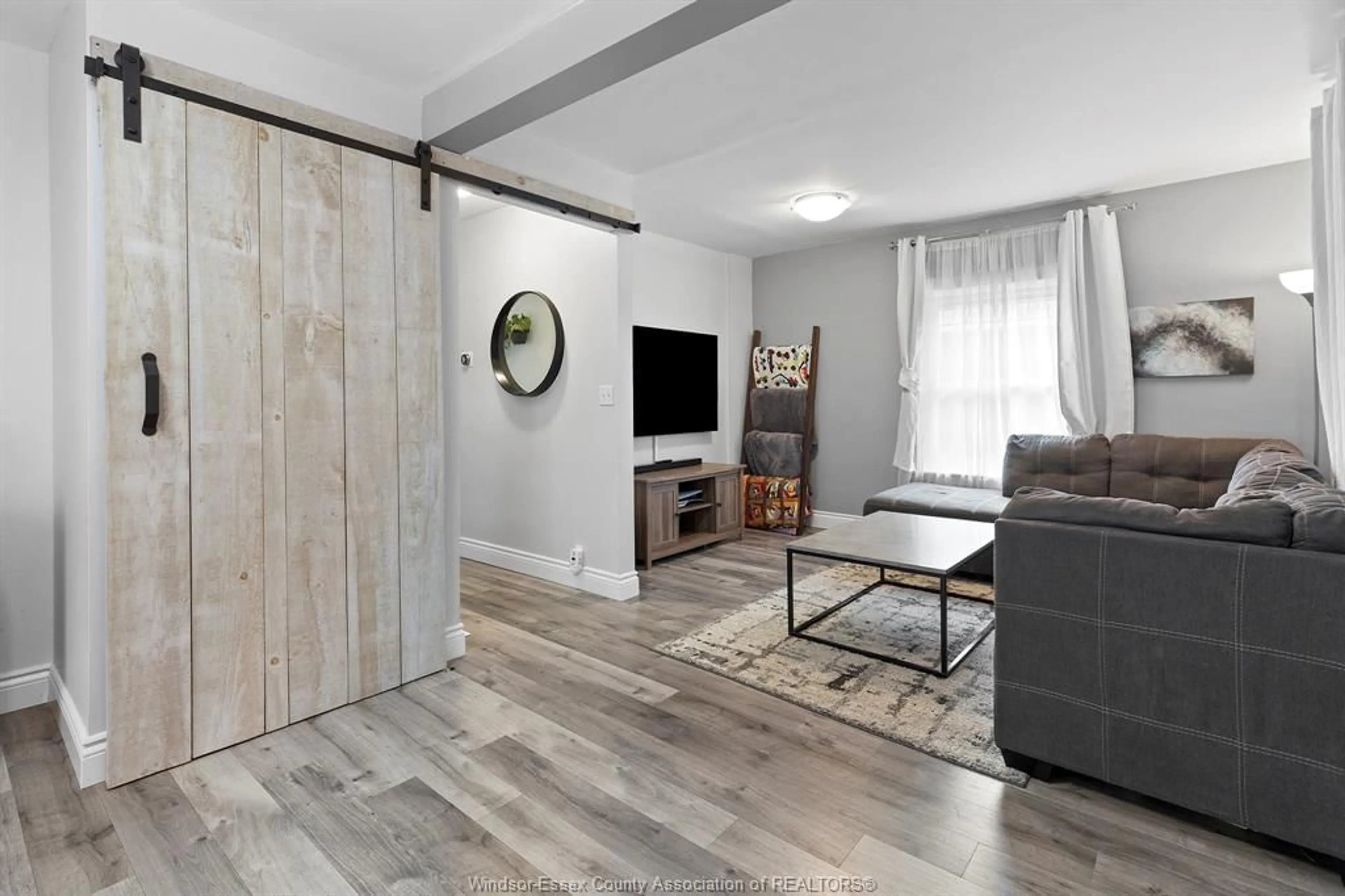 Living room with furniture, wood/laminate floor for 1718 WINDERMERE, Windsor Ontario N8W 2S1