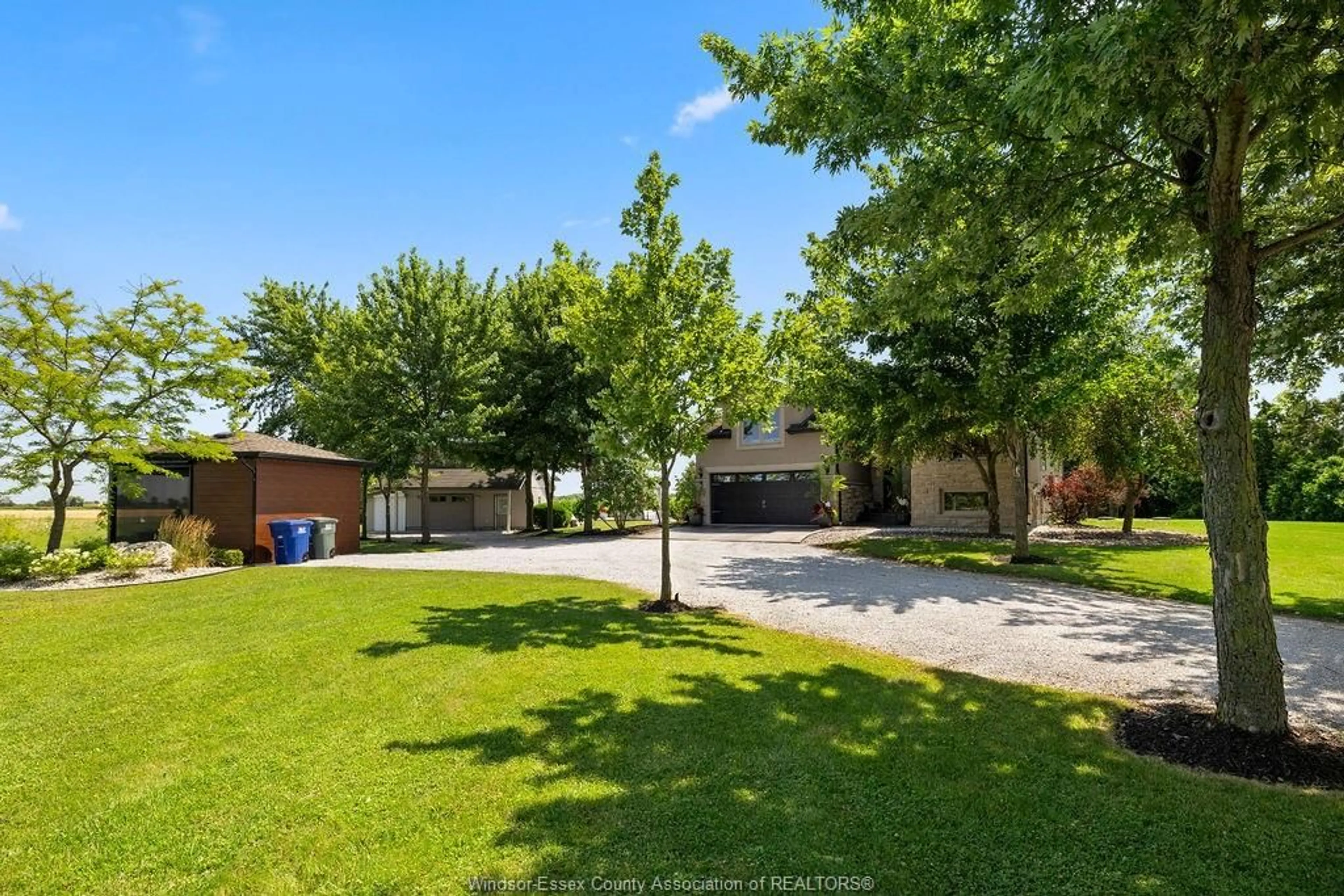 A pic from outside/outdoor area/front of a property/back of a property/a pic from drone, street for 1099 WALLS Rd, Lakeshore Ontario N8M 2X7