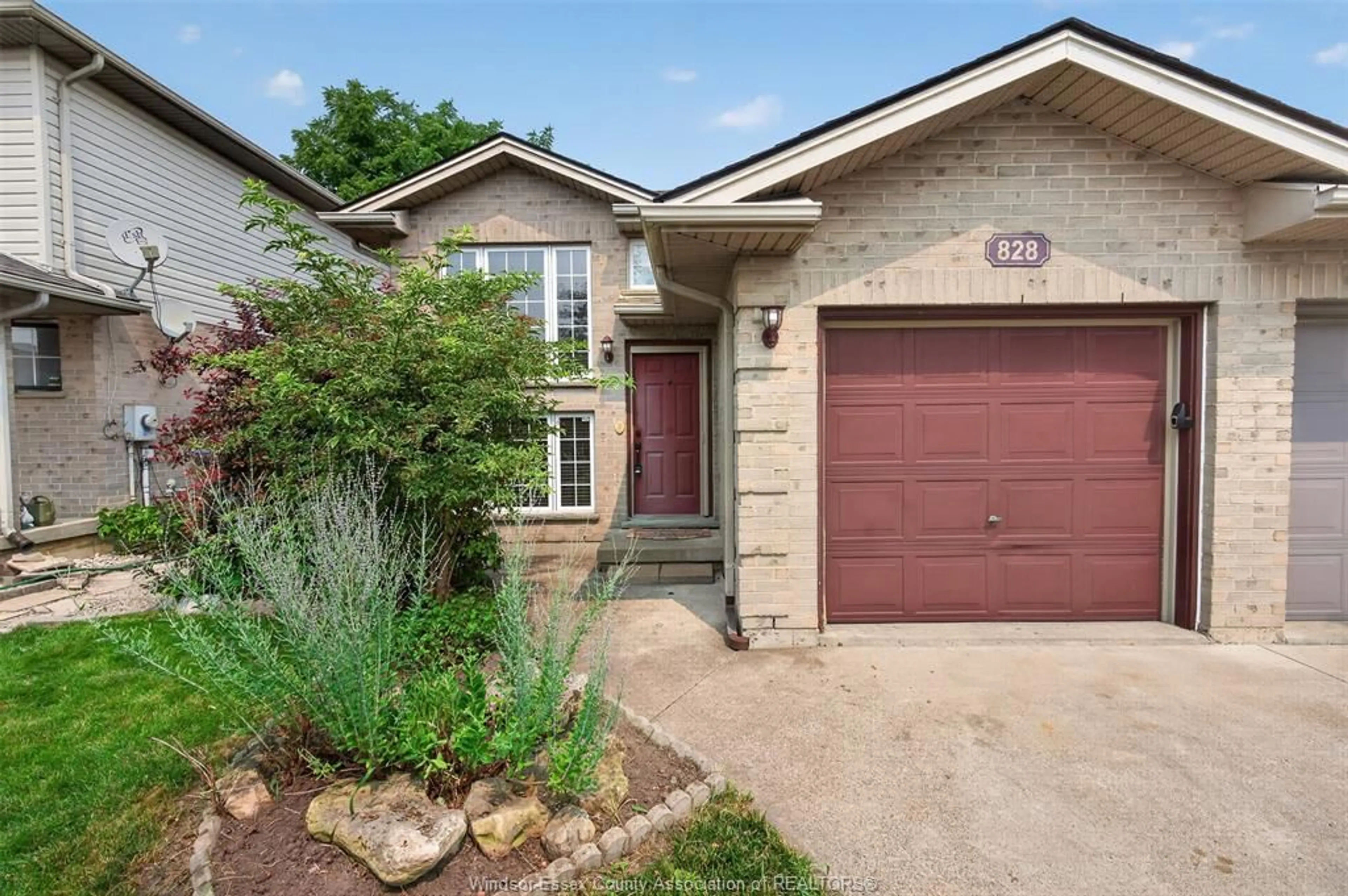 Home with brick exterior material, street for 828 MICHAEL Dr, Tecumseh Ontario N8N 5A3