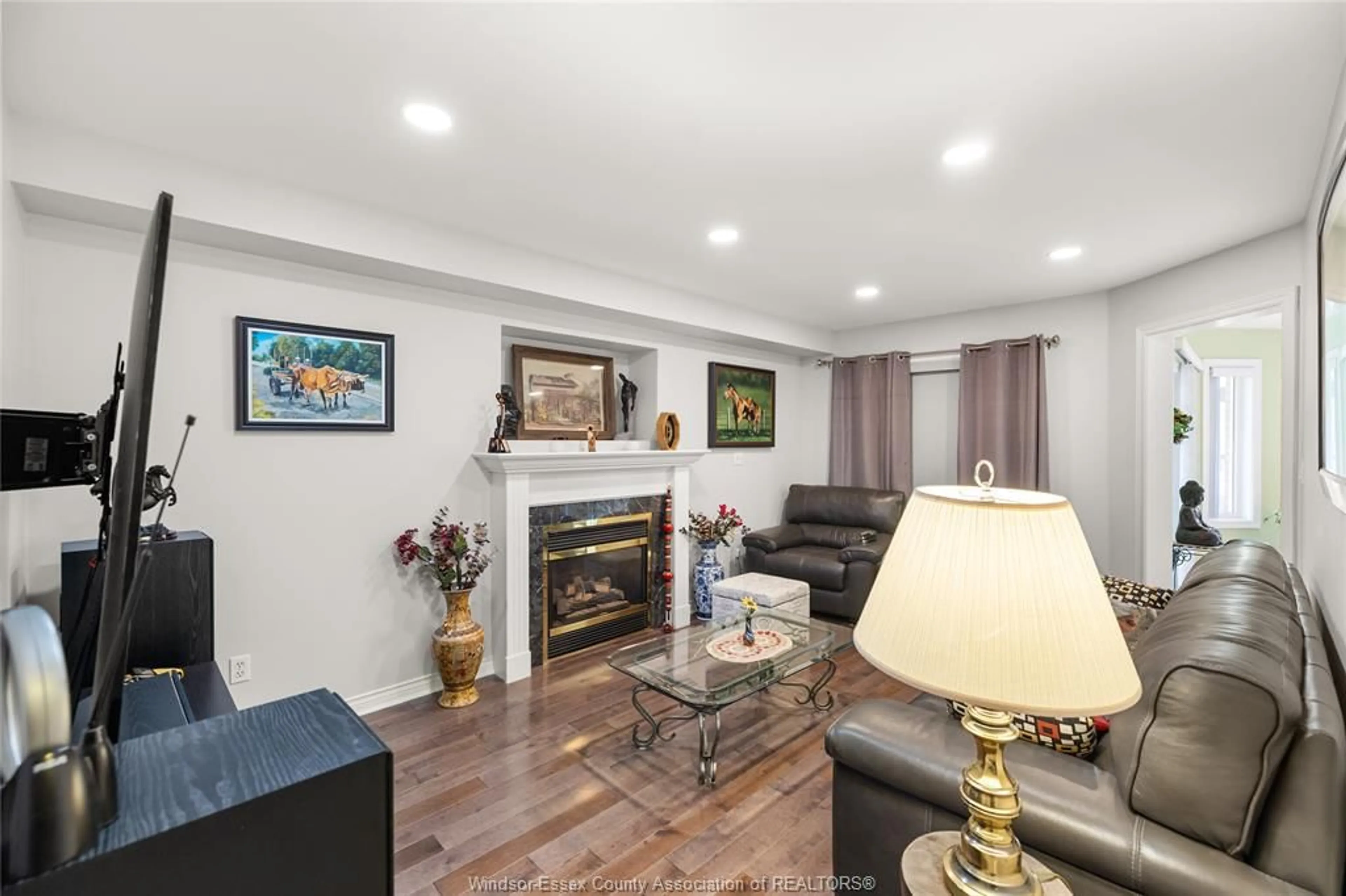 Living room with furniture, wood/laminate floor for 965 GREENPARK, Windsor Ontario N8P 1J1