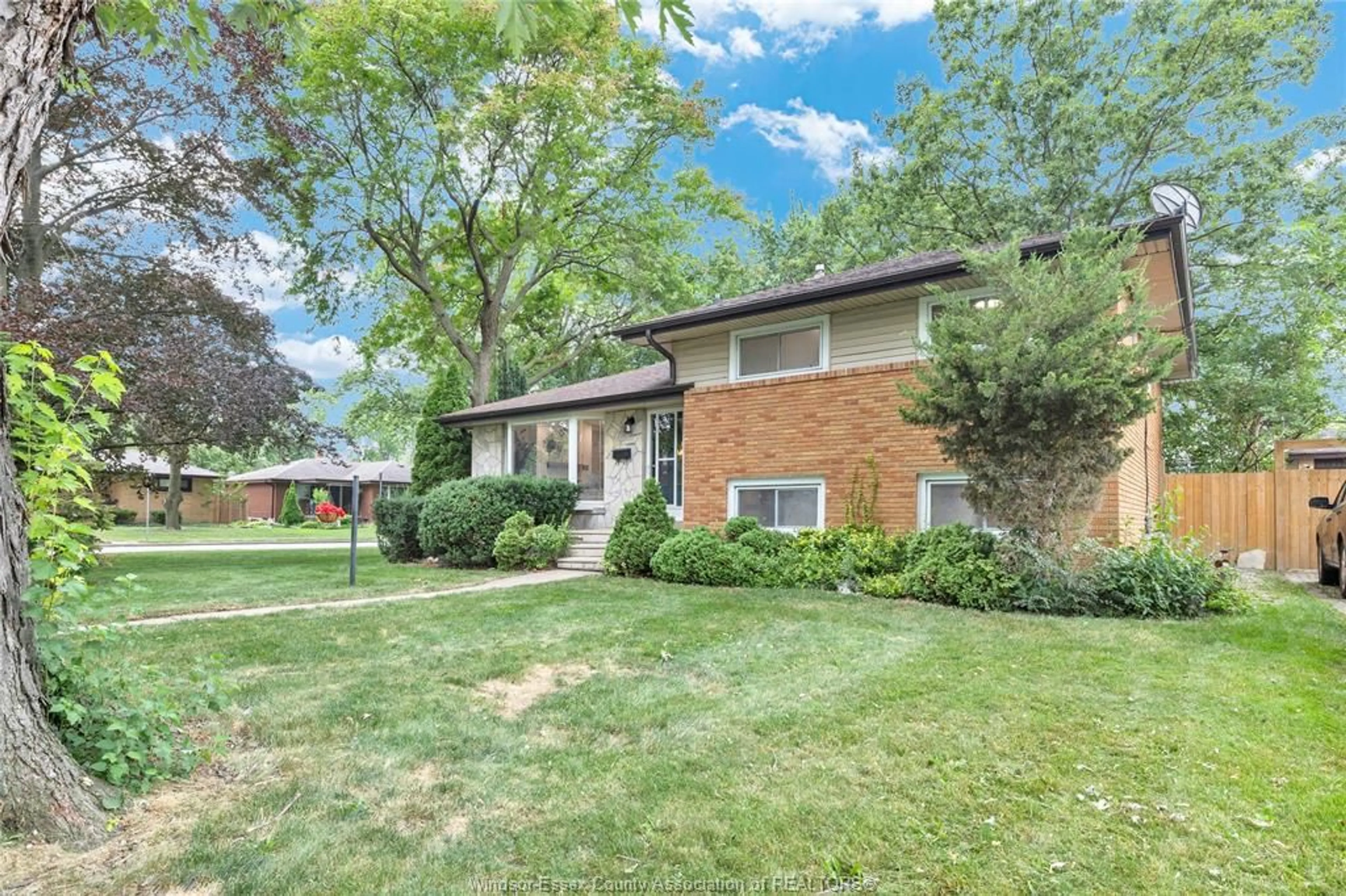 Home with brick exterior material, street for 465 GREENDALE Dr, Windsor Ontario N8S 4A5