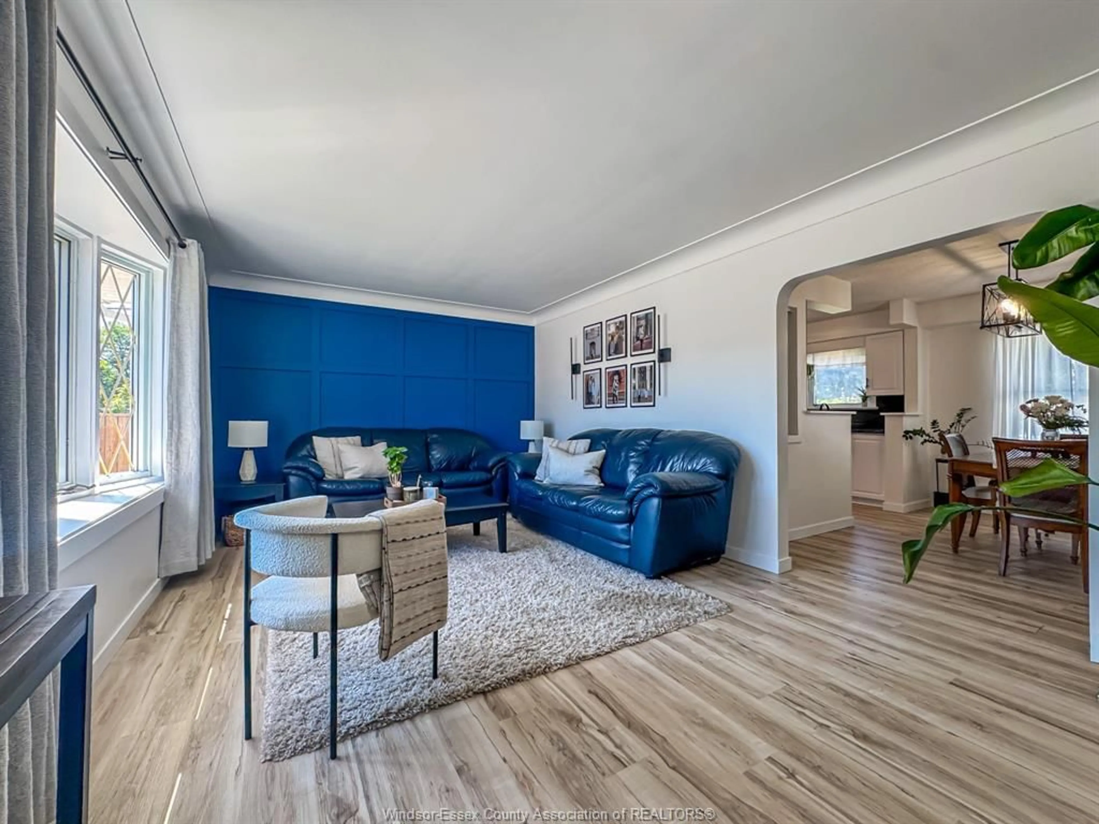 Living room with furniture, wood/laminate floor for 805 MATTHEW BRADY, Windsor Ontario N8S 3J7