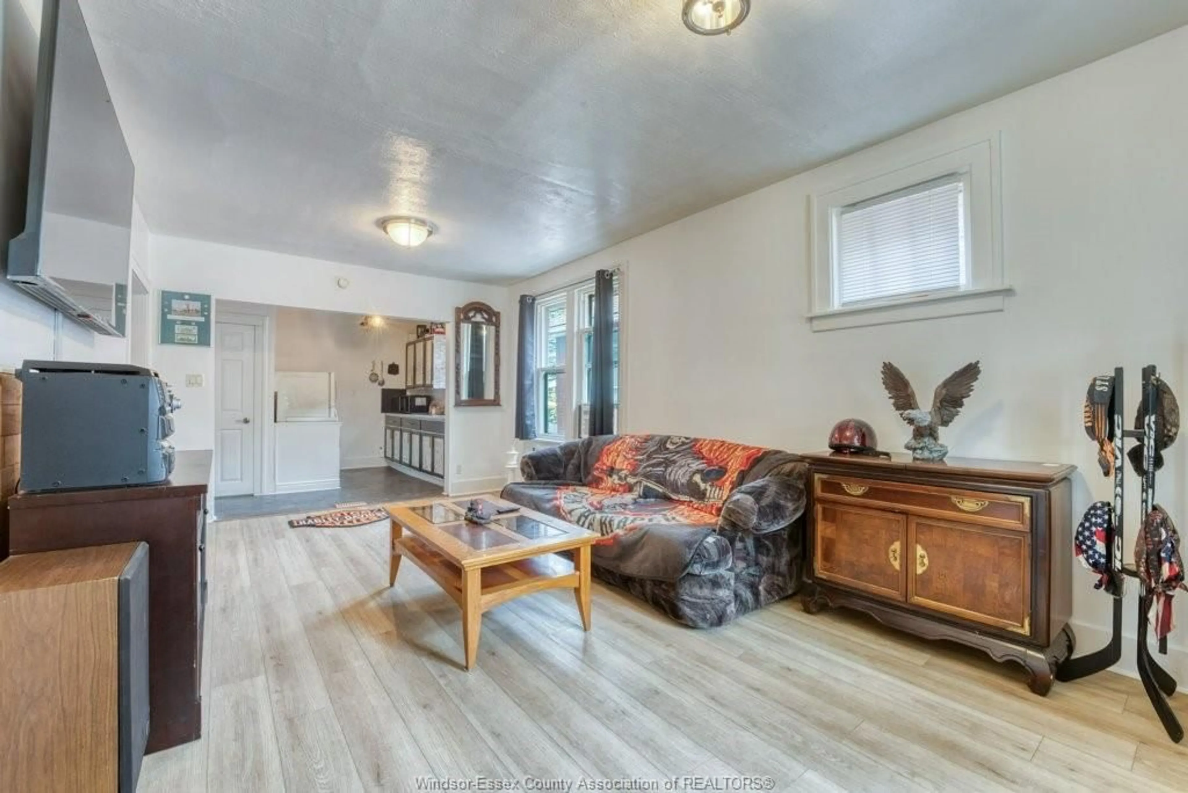 Living room with furniture, wood/laminate floor for 3454 HARRIS St, Windsor Ontario N9C 1N5