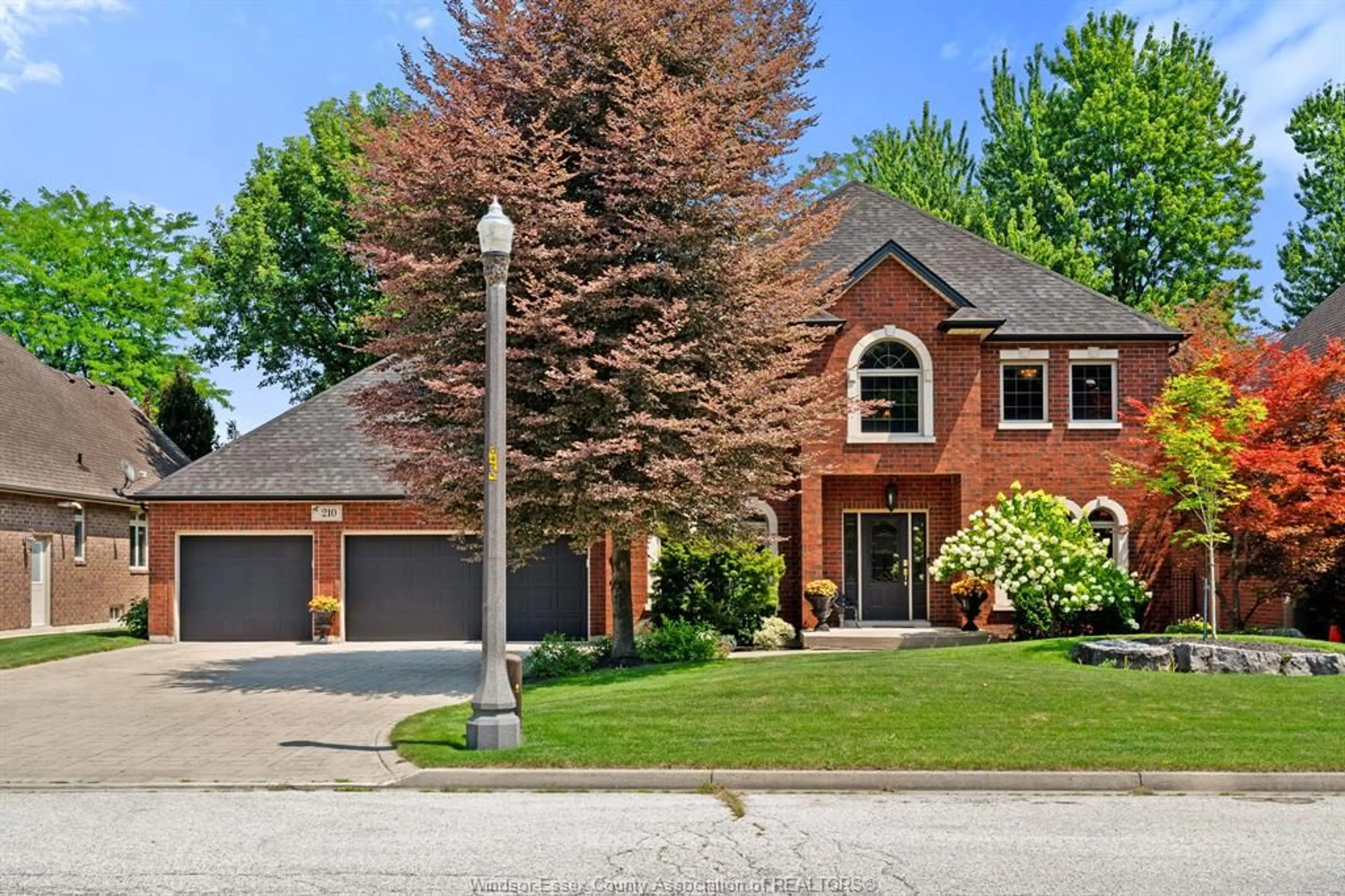 Home with brick exterior material, street for 210 Vintage Oak Dr, Tecumseh Ontario N8N 5H4