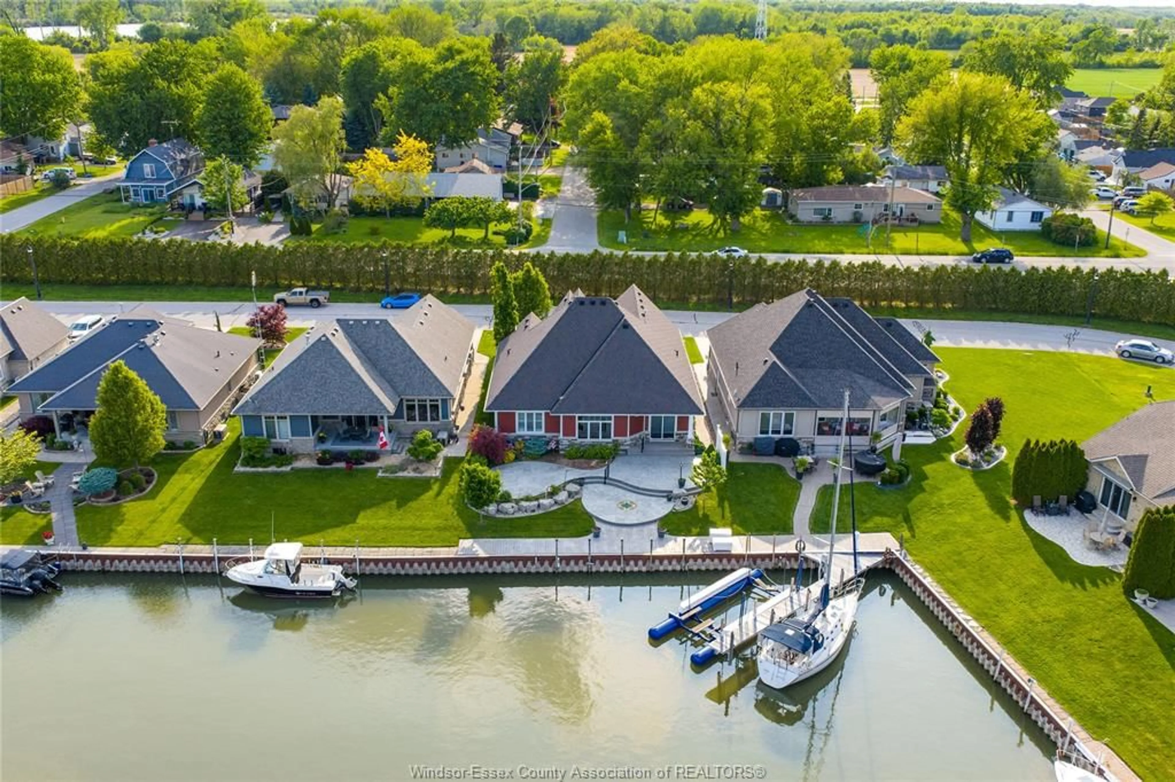 A pic from outside/outdoor area/front of a property/back of a property/a pic from drone, water/lake/river/ocean view for 33 MONTEGO BAY Cres, Kingsville Ontario N9Y 4E7