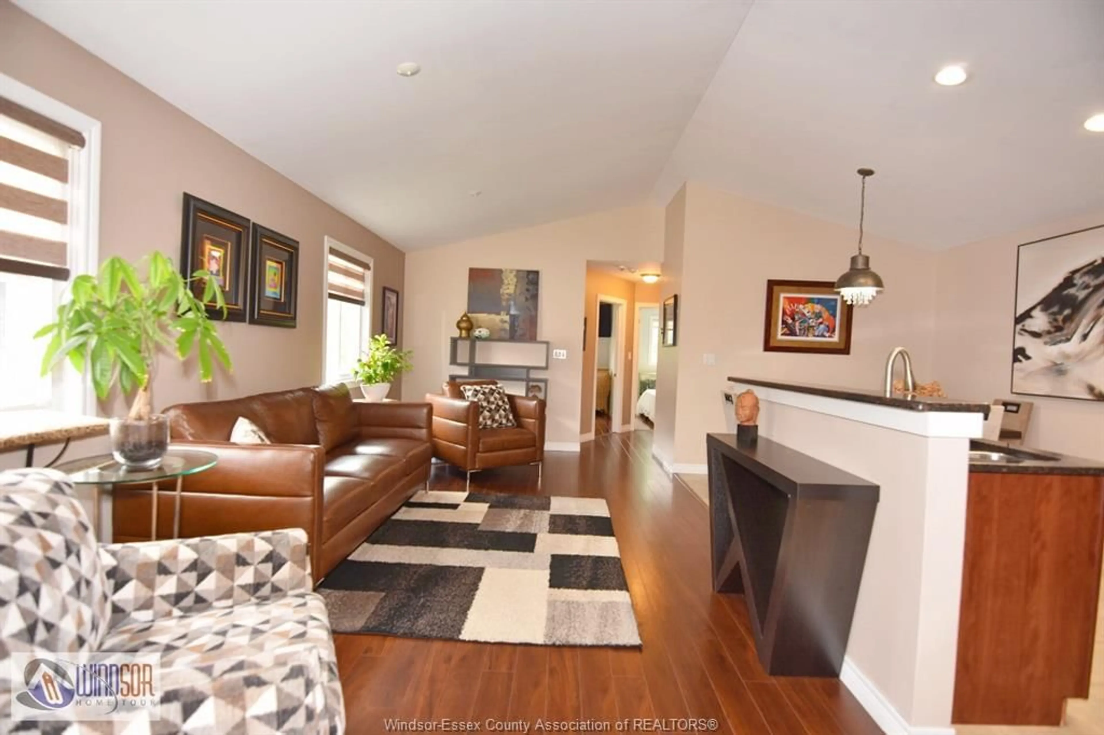 Living room with furniture, wood/laminate floor for 2271 LAMONT St, Windsor Ontario N9E 4X5