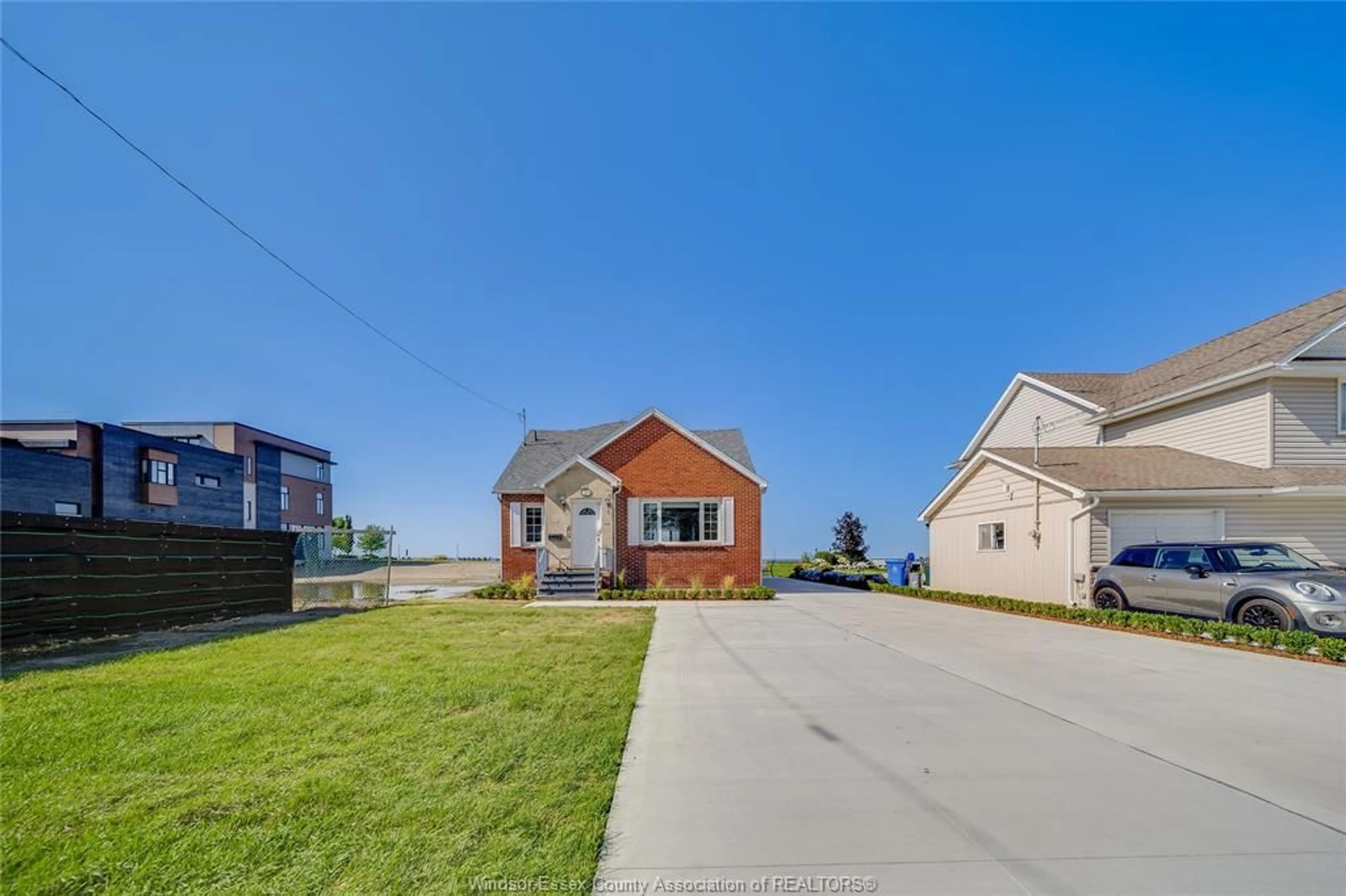 A pic from outside/outdoor area/front of a property/back of a property/a pic from drone, water/lake/river/ocean view for 13902 RIVERSIDE Dr, Tecumseh Ontario N8W 1B6