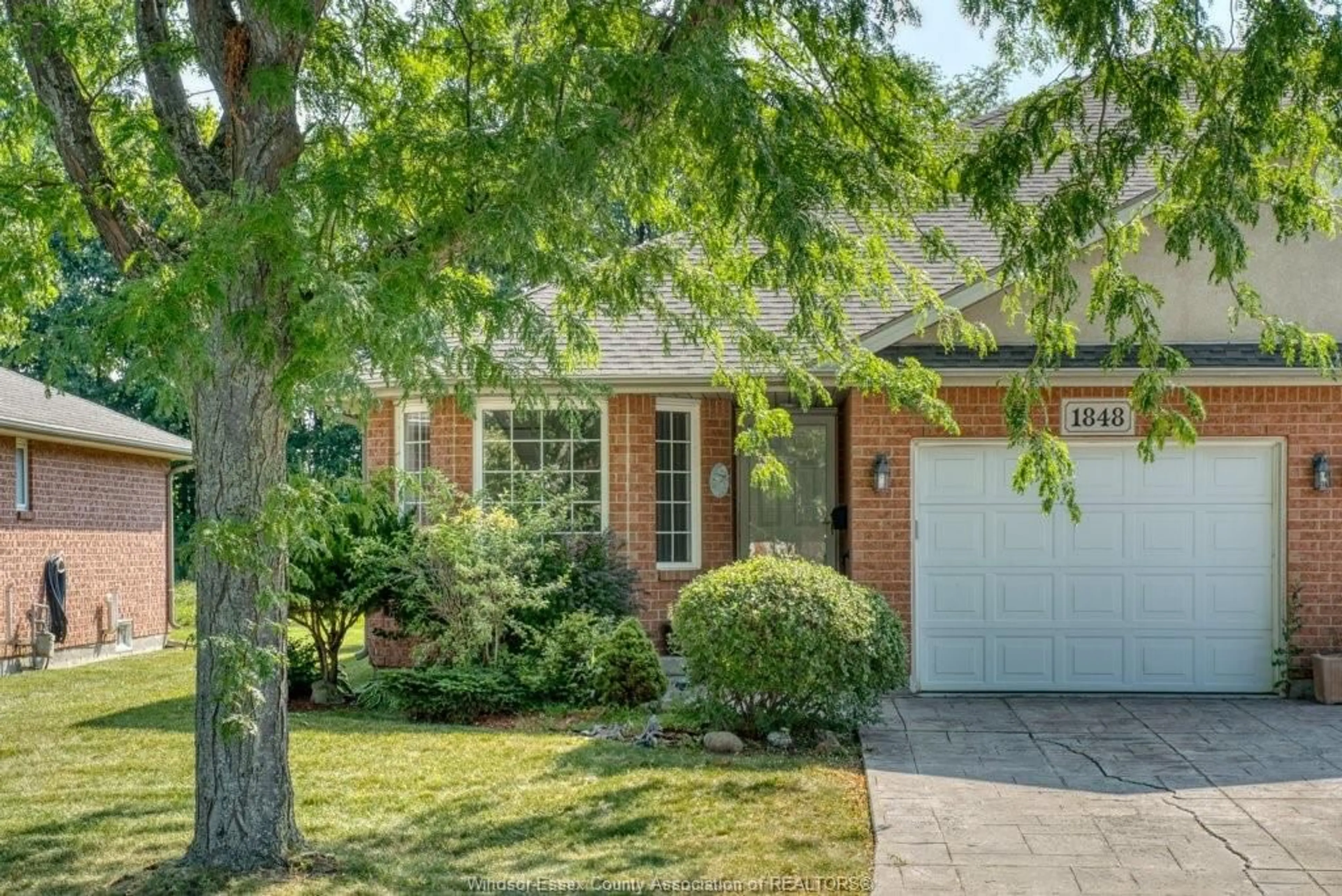 Home with brick exterior material, street for 1848 Questa Dr, Windsor Ontario N8P 1M5