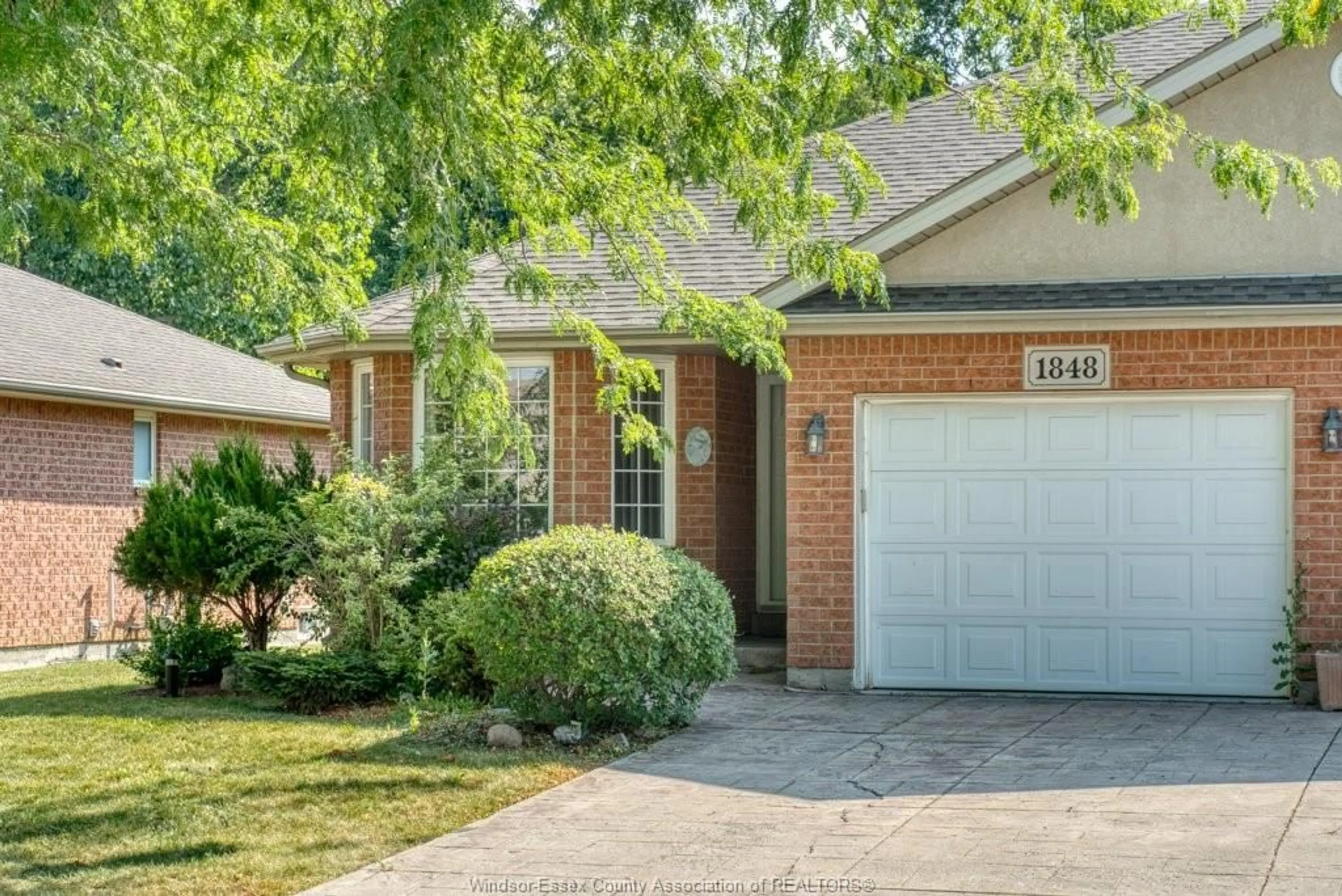 Home with brick exterior material, street for 1848 Questa Dr, Windsor Ontario N8P 1M5