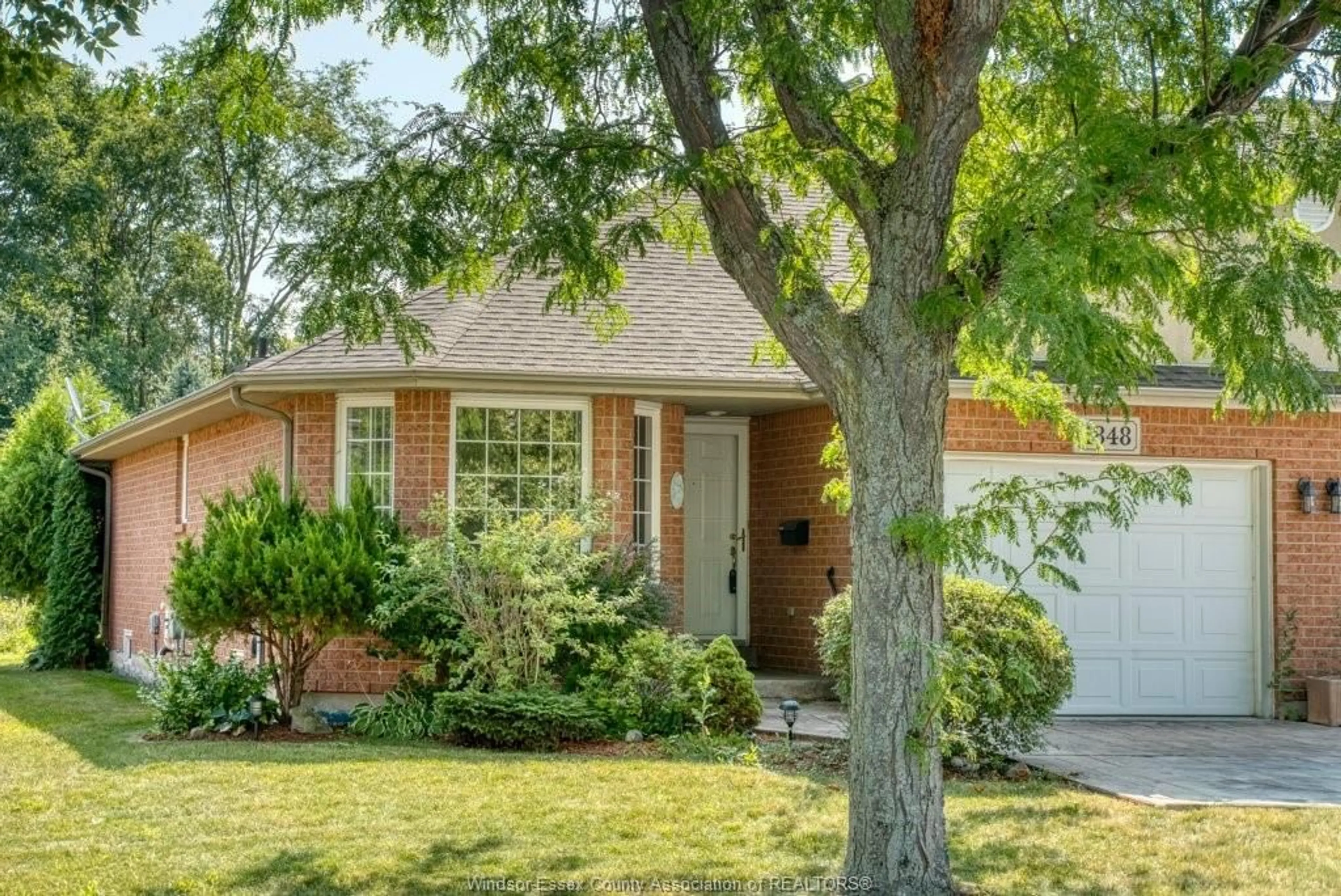 Home with brick exterior material, street for 1848 Questa Dr, Windsor Ontario N8P 1M5