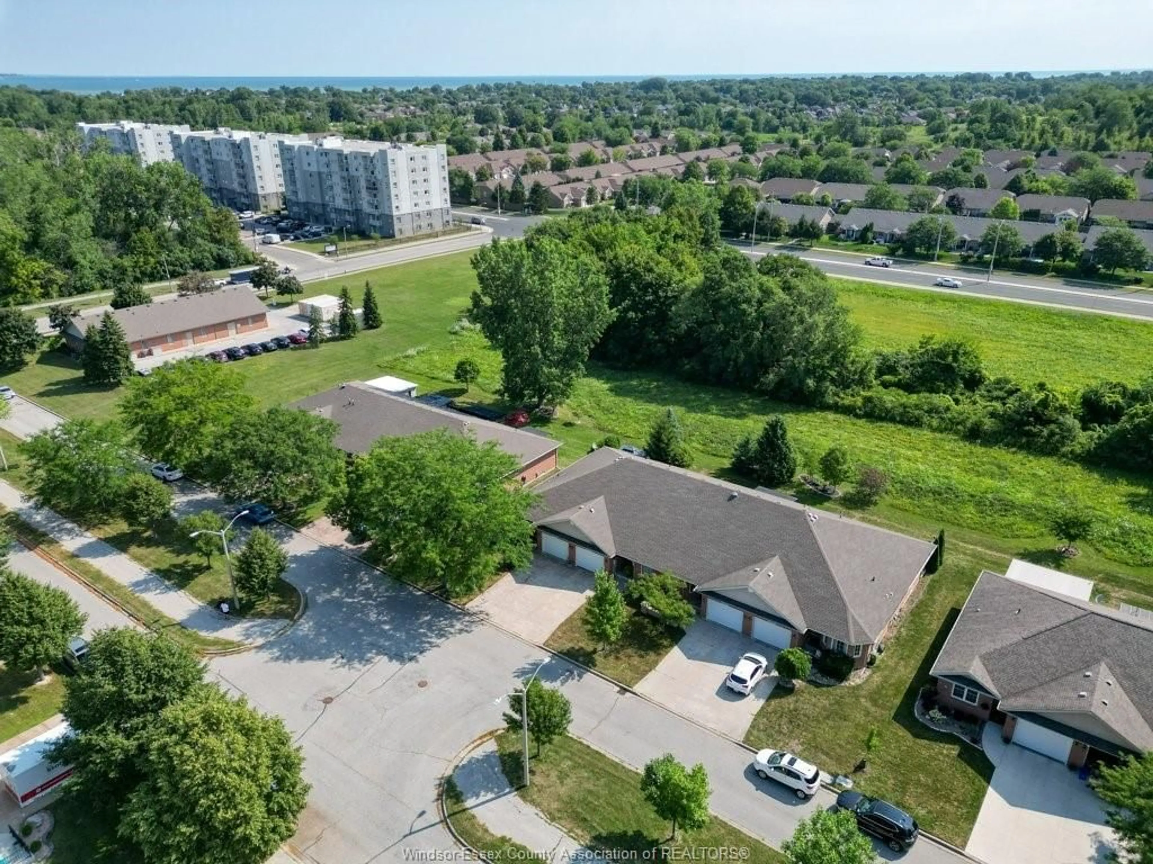 A pic from outside/outdoor area/front of a property/back of a property/a pic from drone, street for 1848 Questa Dr, Windsor Ontario N8P 1M5