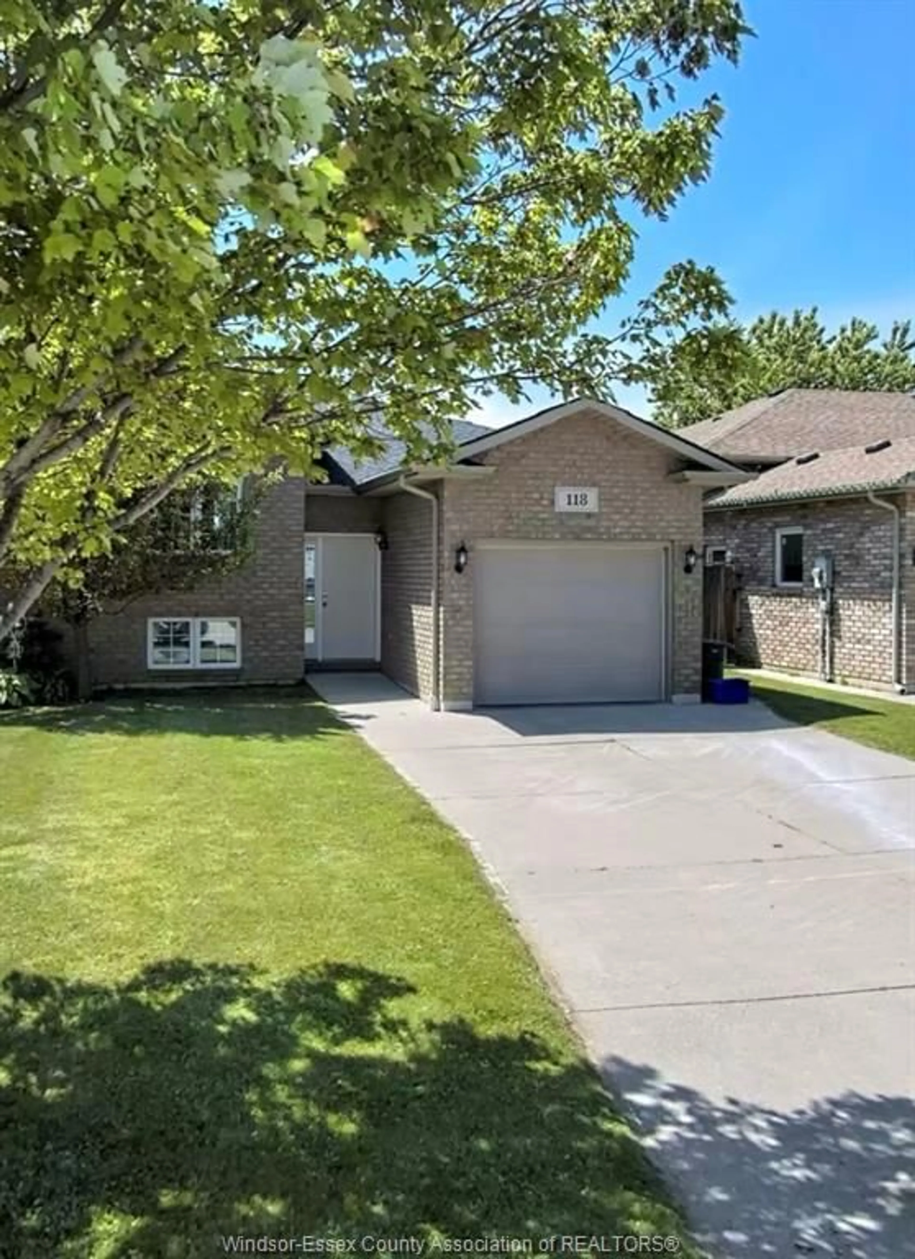 Home with brick exterior material, street for 118 Sturgeon Meadows Ave, Leamington Ontario N8H 5L1