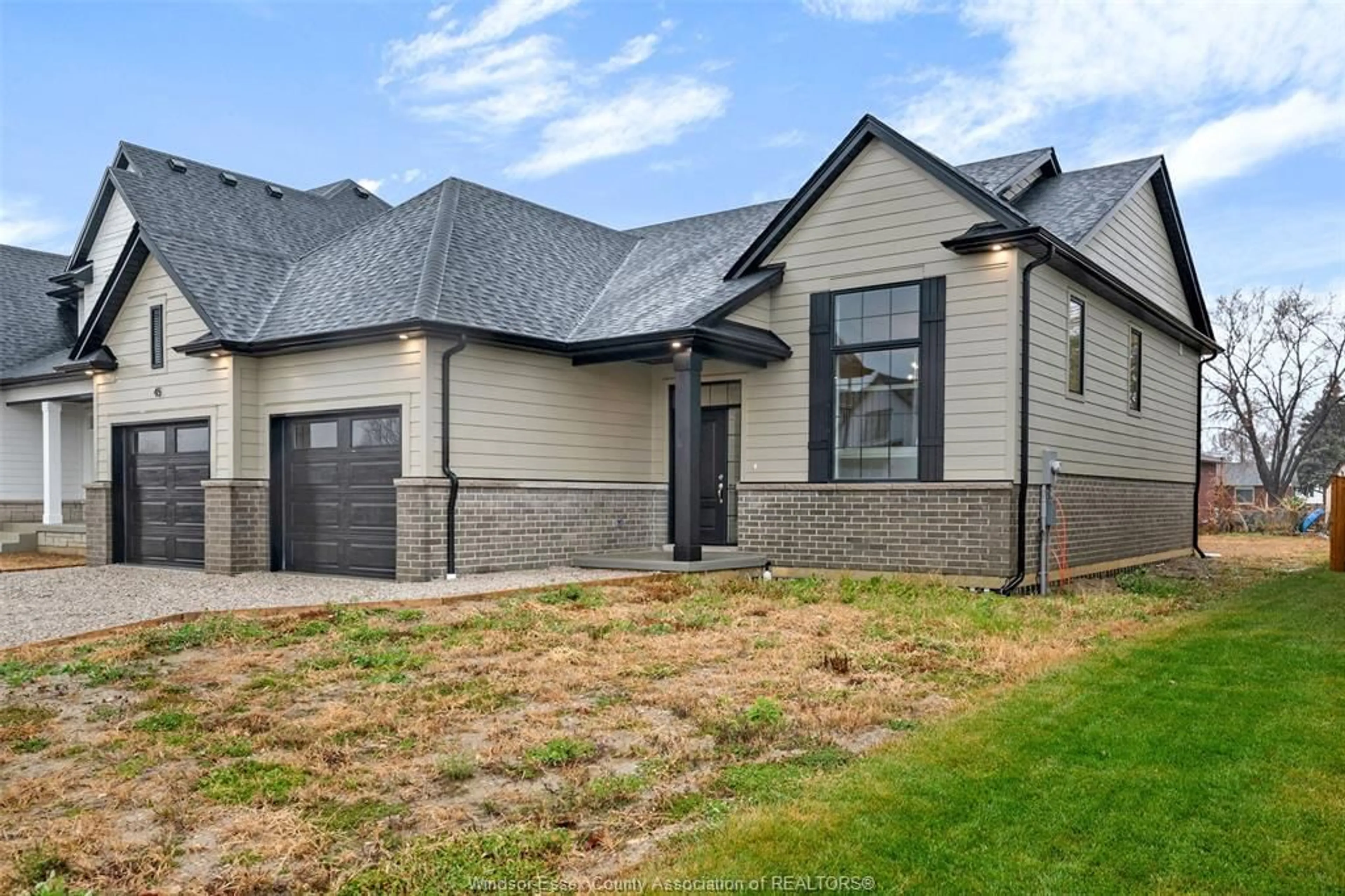 Home with brick exterior material, street for 52 BELLEVIEW Dr, Kingsville Ontario N0R 1B0