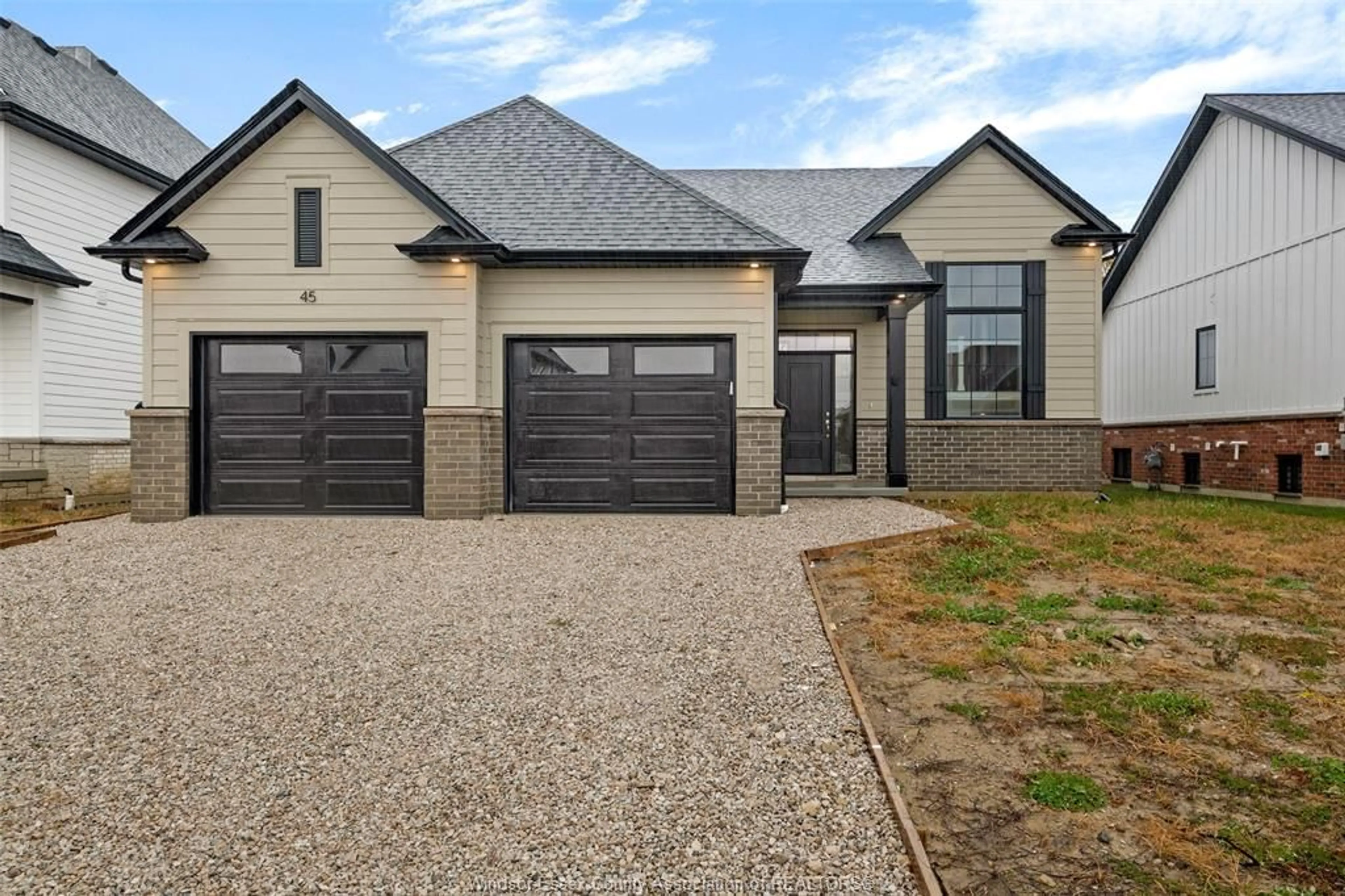 Home with brick exterior material, street for 52 BELLEVIEW Dr, Kingsville Ontario N0R 1B0