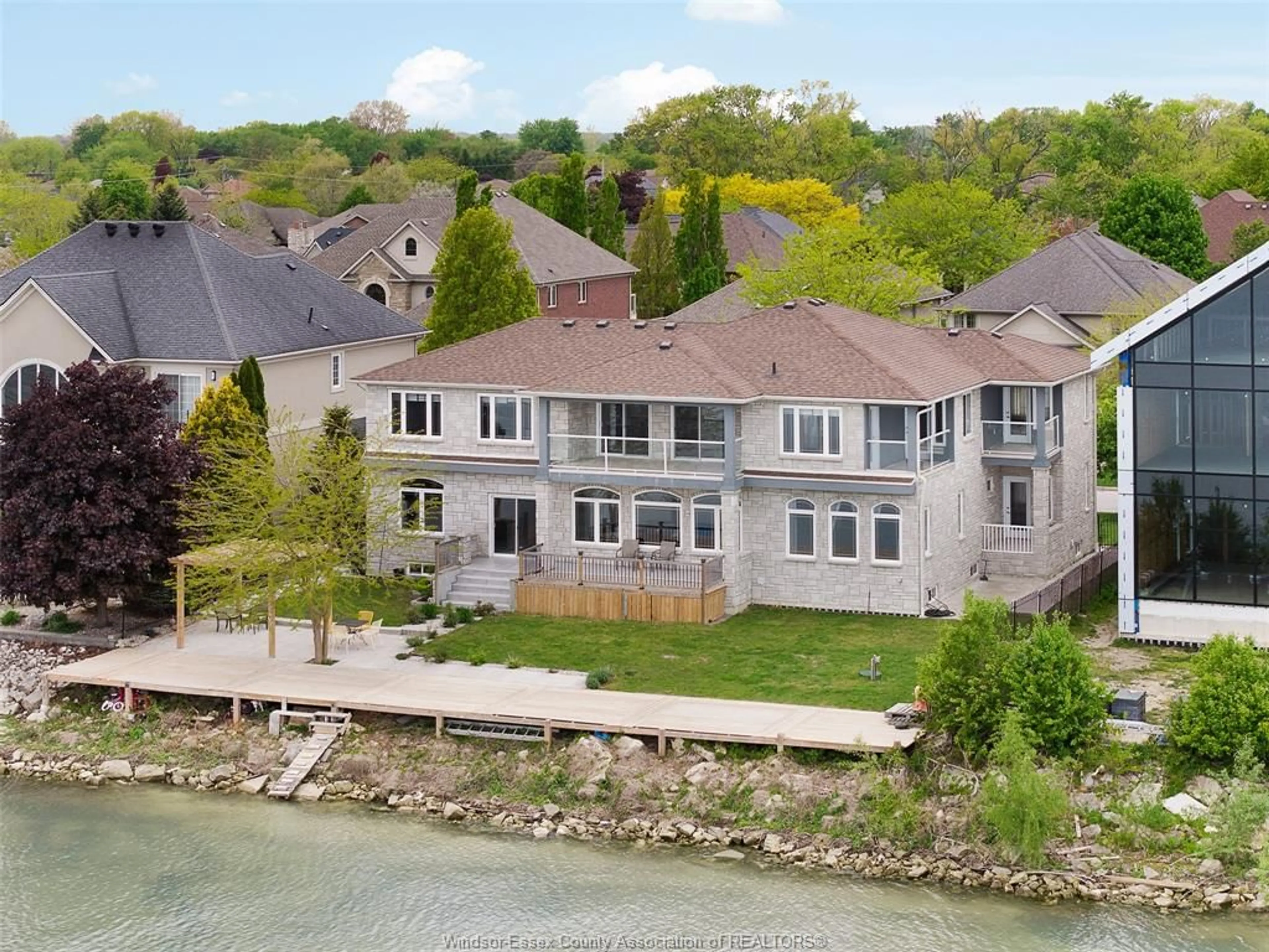A pic from outside/outdoor area/front of a property/back of a property/a pic from drone, water/lake/river/ocean view for 300 SHOREVIEW Cir, Windsor Ontario N8P 1M7